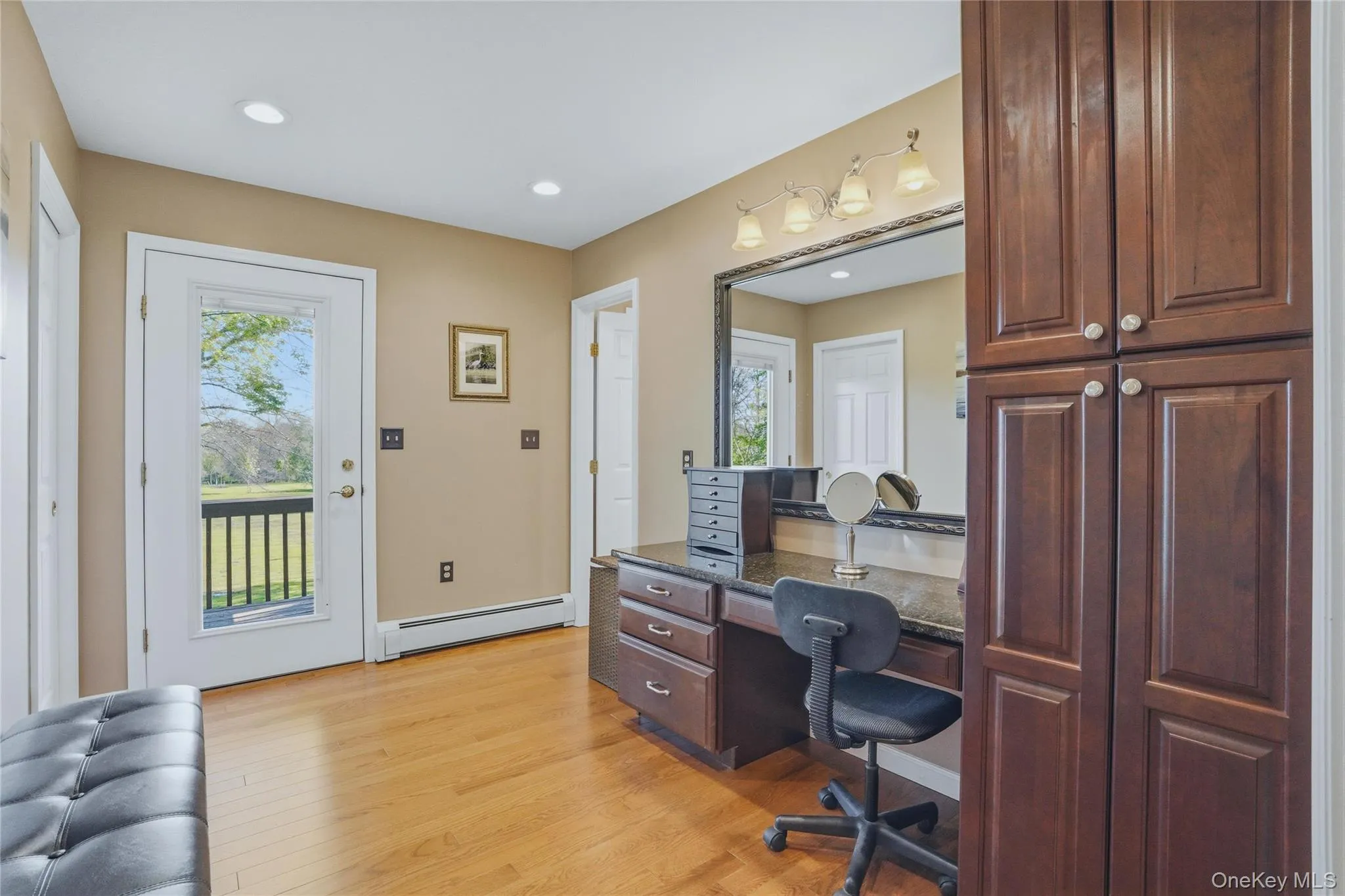 Vanity area with two walk-in closets on the opposite wall Vanity area with two walk-in closets on the opposite wall