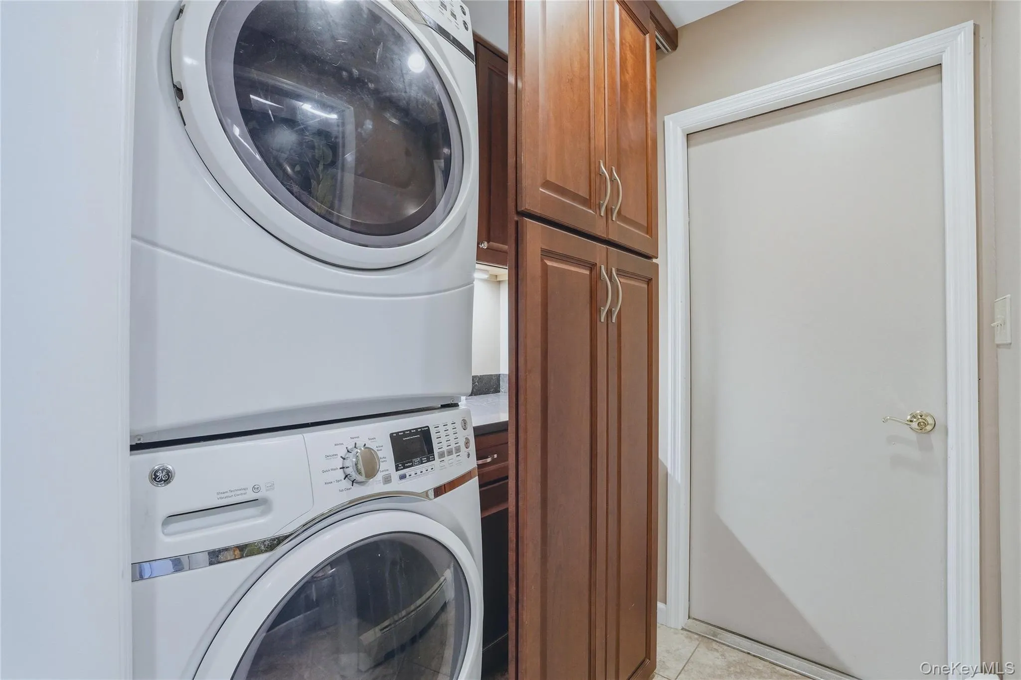 Washer/dryer with siding door to cover them when not in use. Washer/dryer with siding door to cover them when not in use.