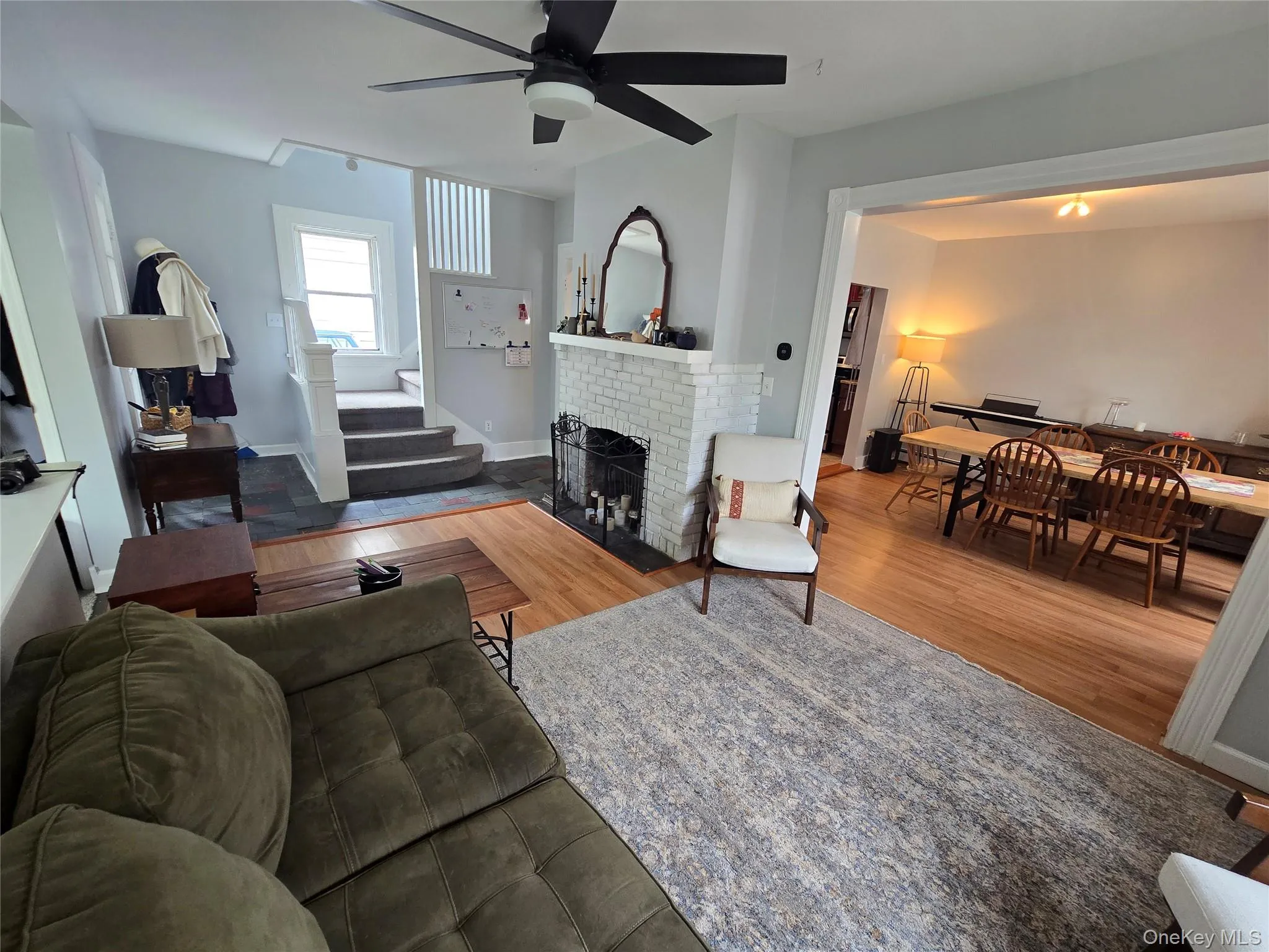 Mudroom entry, living room, dining room, and stairway Mudroom entry, living room, dining room, and stairway