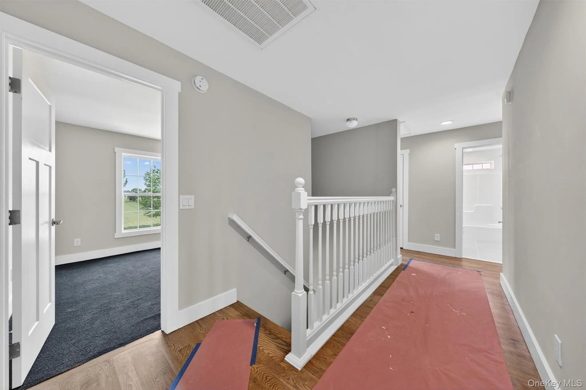 Second floor hallway with hardwood flooring. Second floor hallway with hardwood flooring.