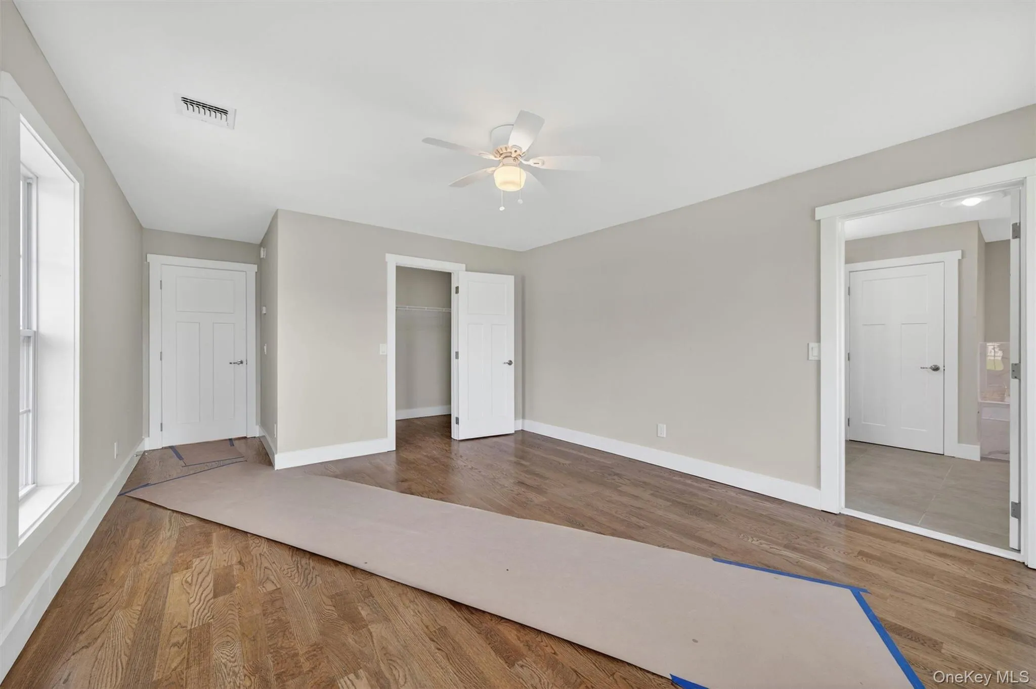 Hardwood flooring and walk-in closet. Hardwood flooring and walk-in closet.