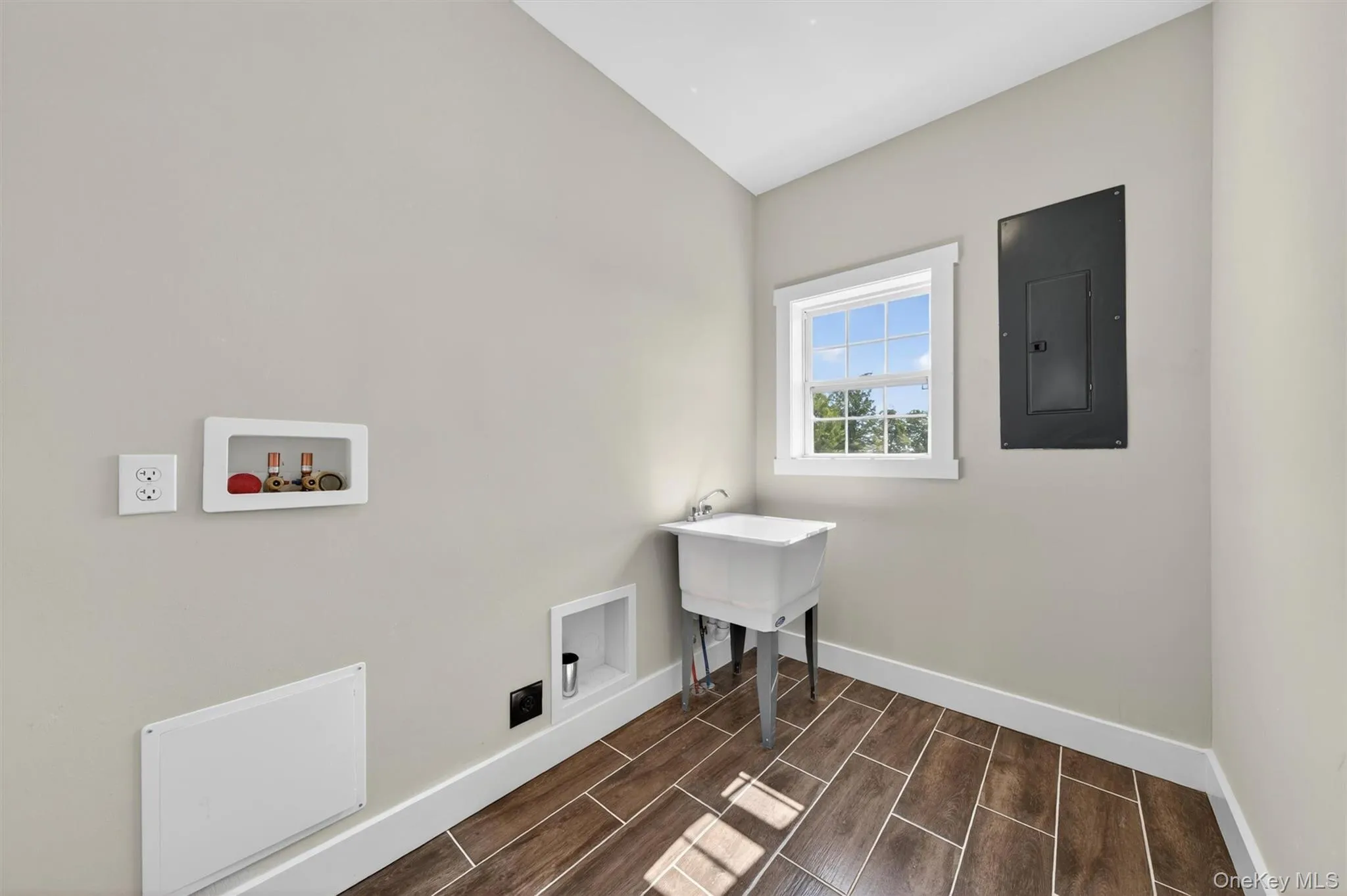 Ceramic tile flooring, window and utility sink. Ceramic tile flooring, window and utility sink.
