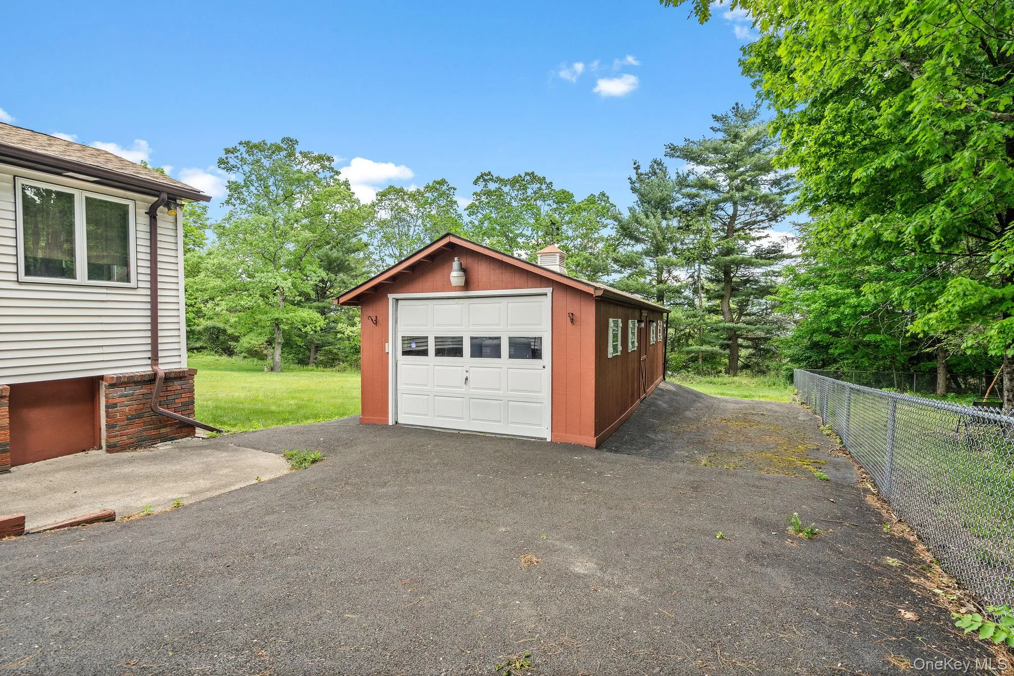 Oversized garage provides options for storage or a workspace. Oversized garage provides options for storage or a workspace.