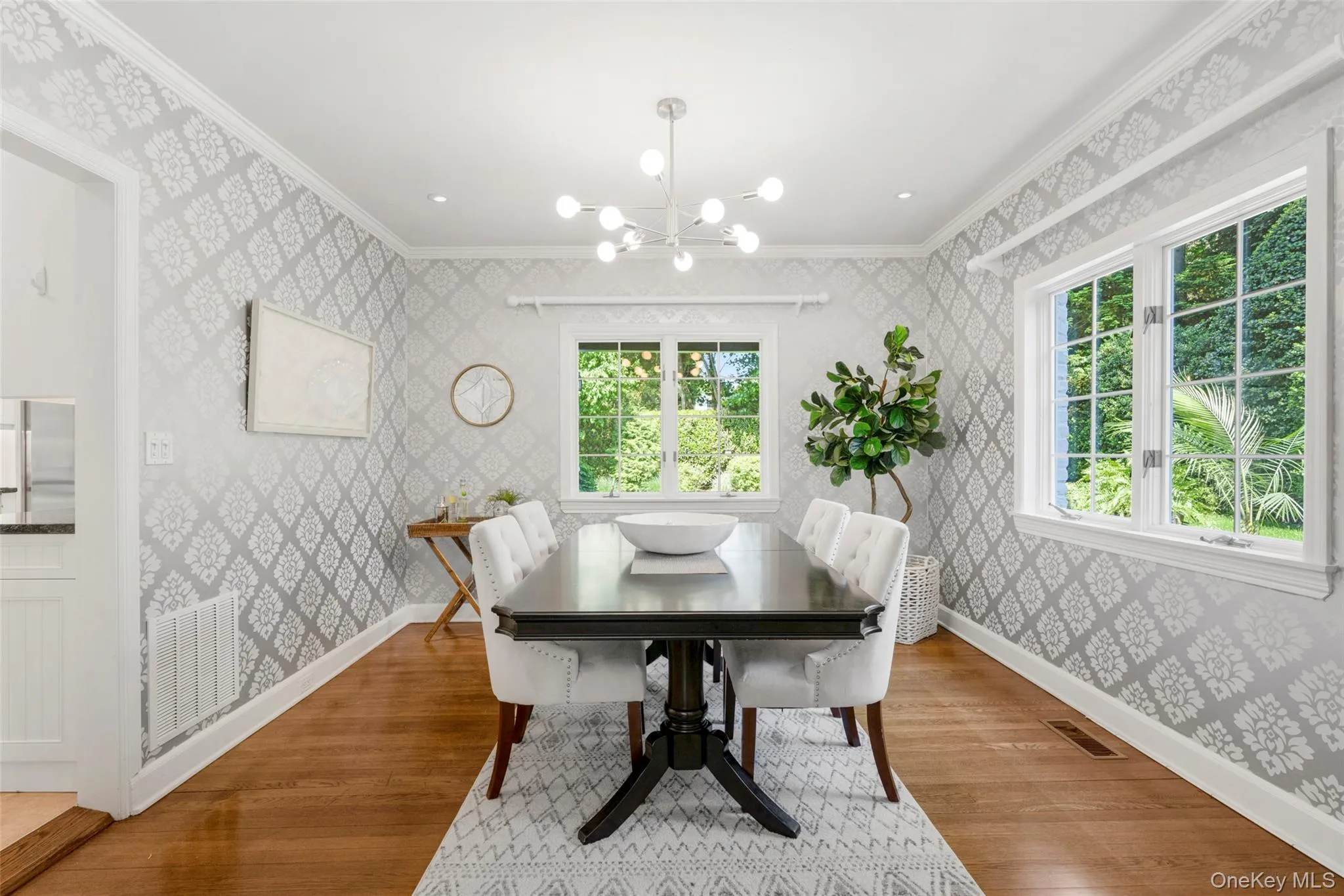 Spacious dining room with classic charm and serene garden views Spacious dining room with classic charm and serene garden views