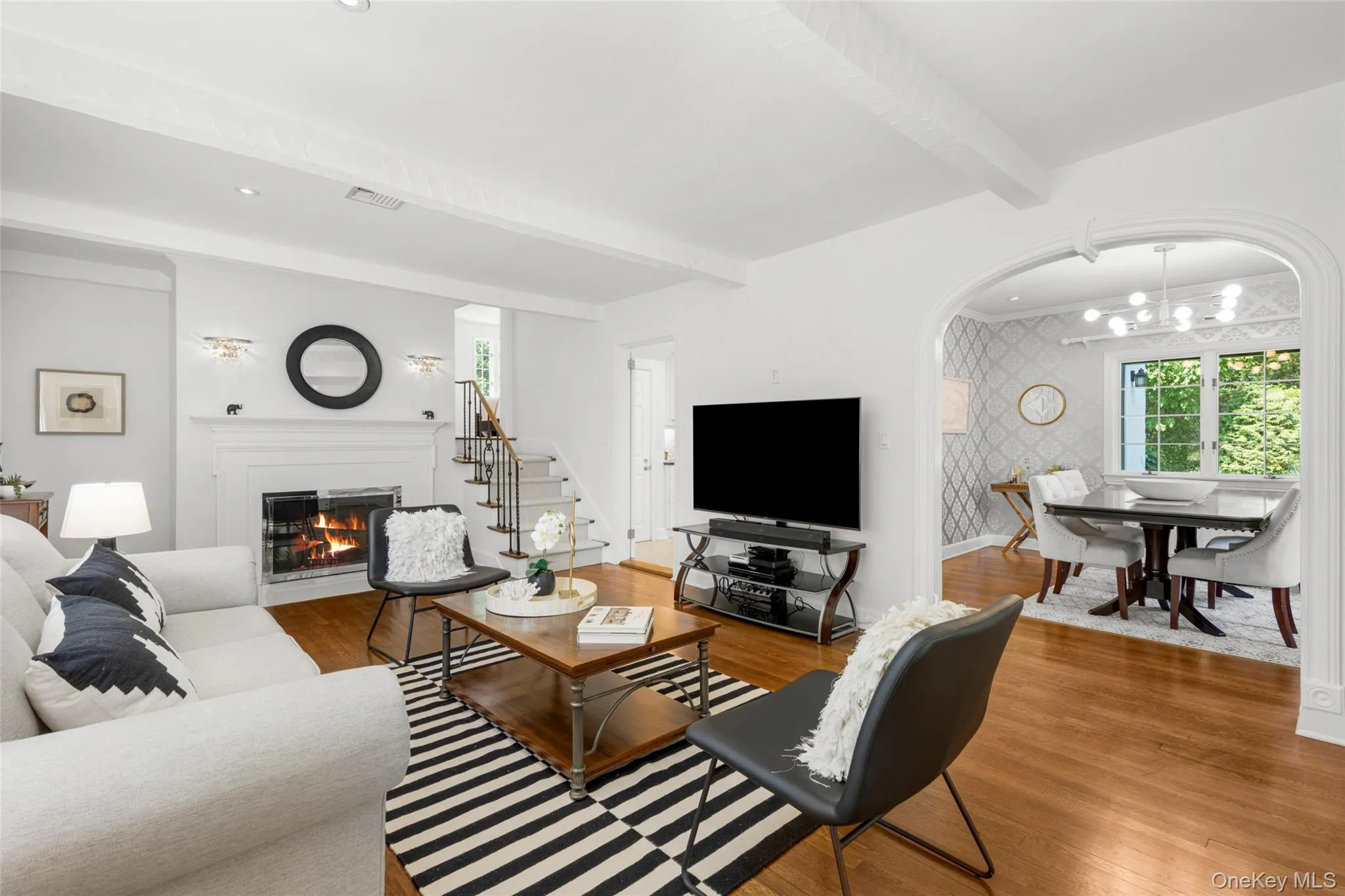 An elegant fireplace with stone surround An elegant fireplace with stone surround