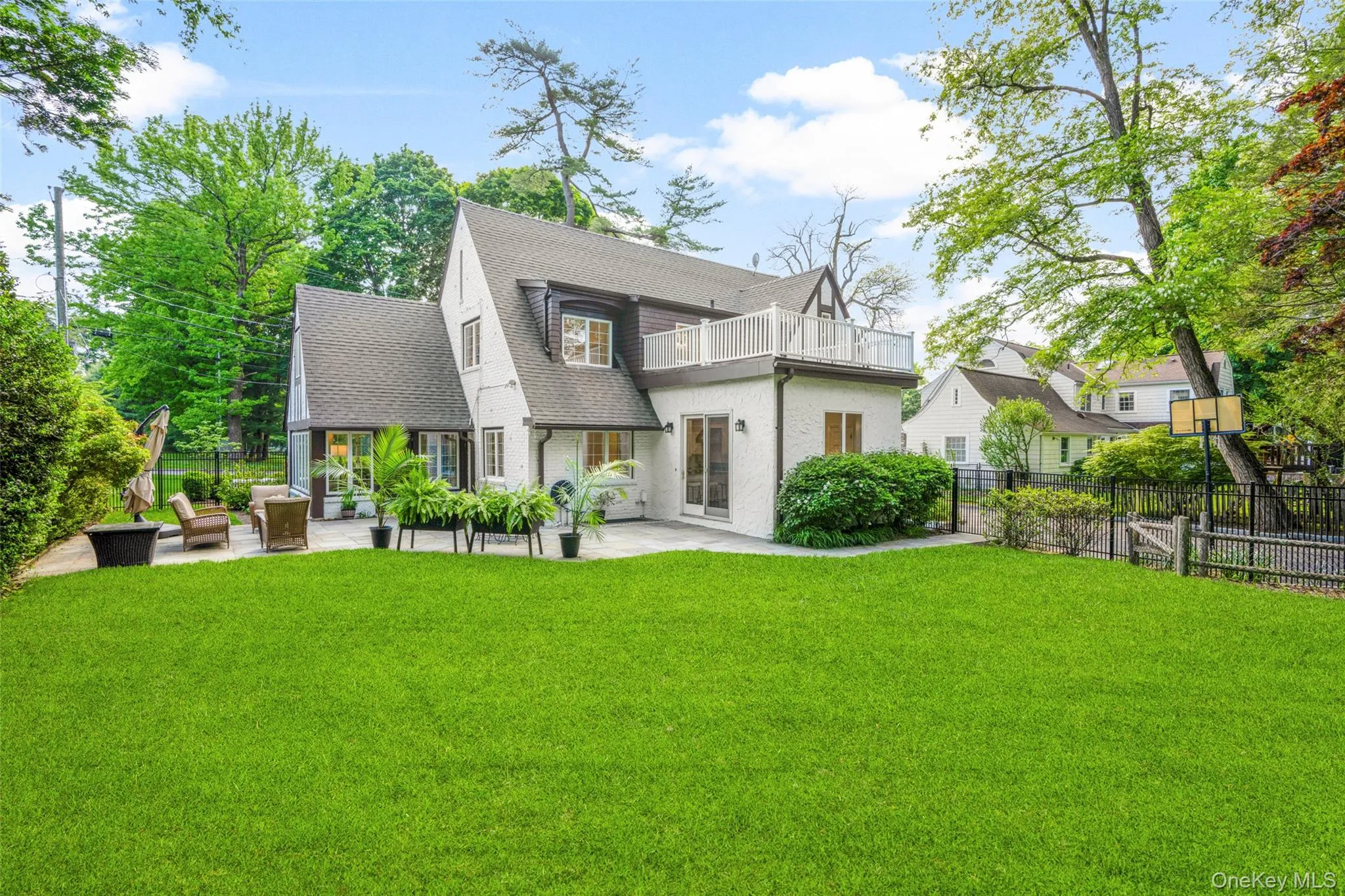 Fully fenced backyard with expansive greenspace for play or gardening. Fully fenced backyard with expansive greenspace for play or gardening.