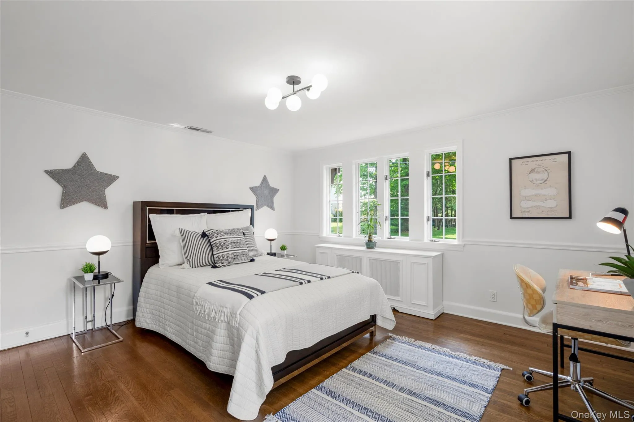 Large windows and gleaming hardwood floors. Large windows and gleaming hardwood floors.