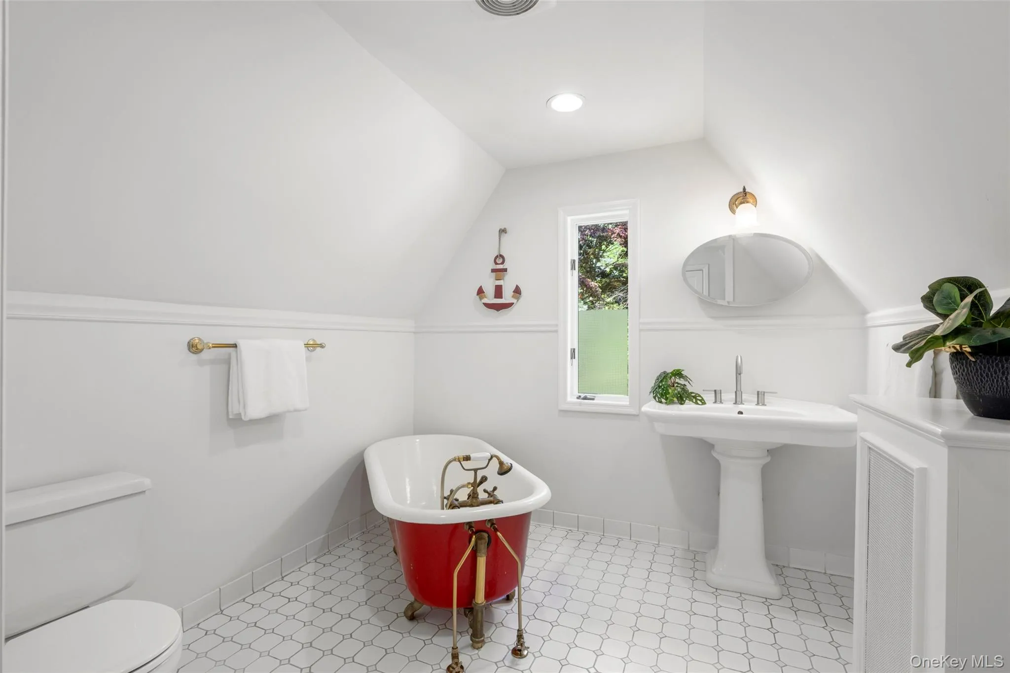 Whimsical clawfoot tub and and charming architectural lines Whimsical clawfoot tub and and charming architectural lines