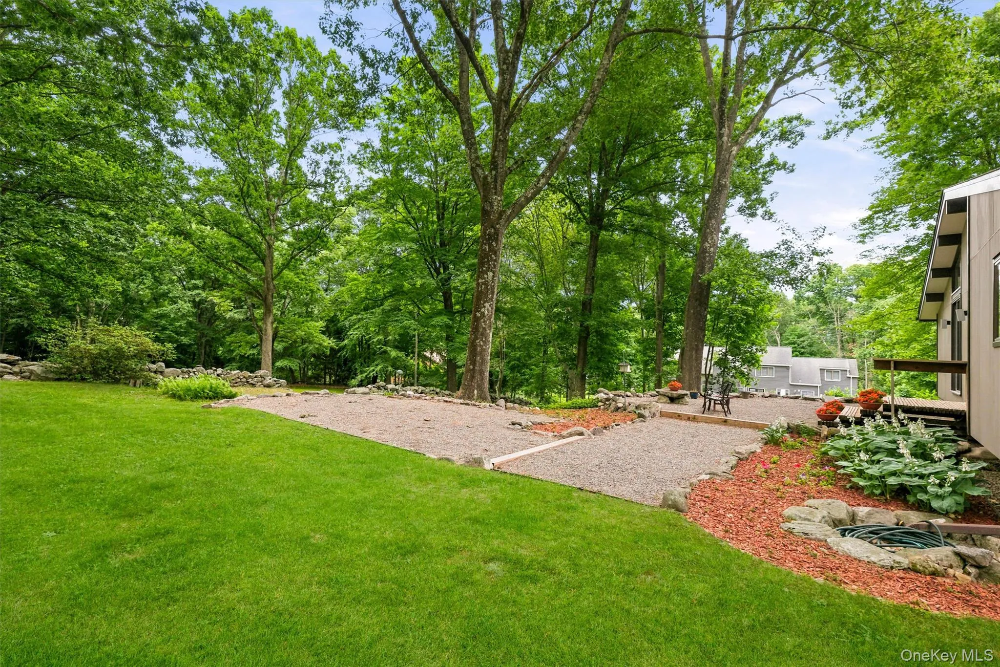 Expansive green lawn with mature trees Expansive green lawn with mature trees