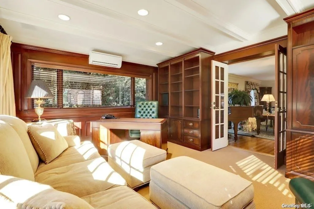 Den/office with built- in cabinetry Den/office with built- in cabinetry