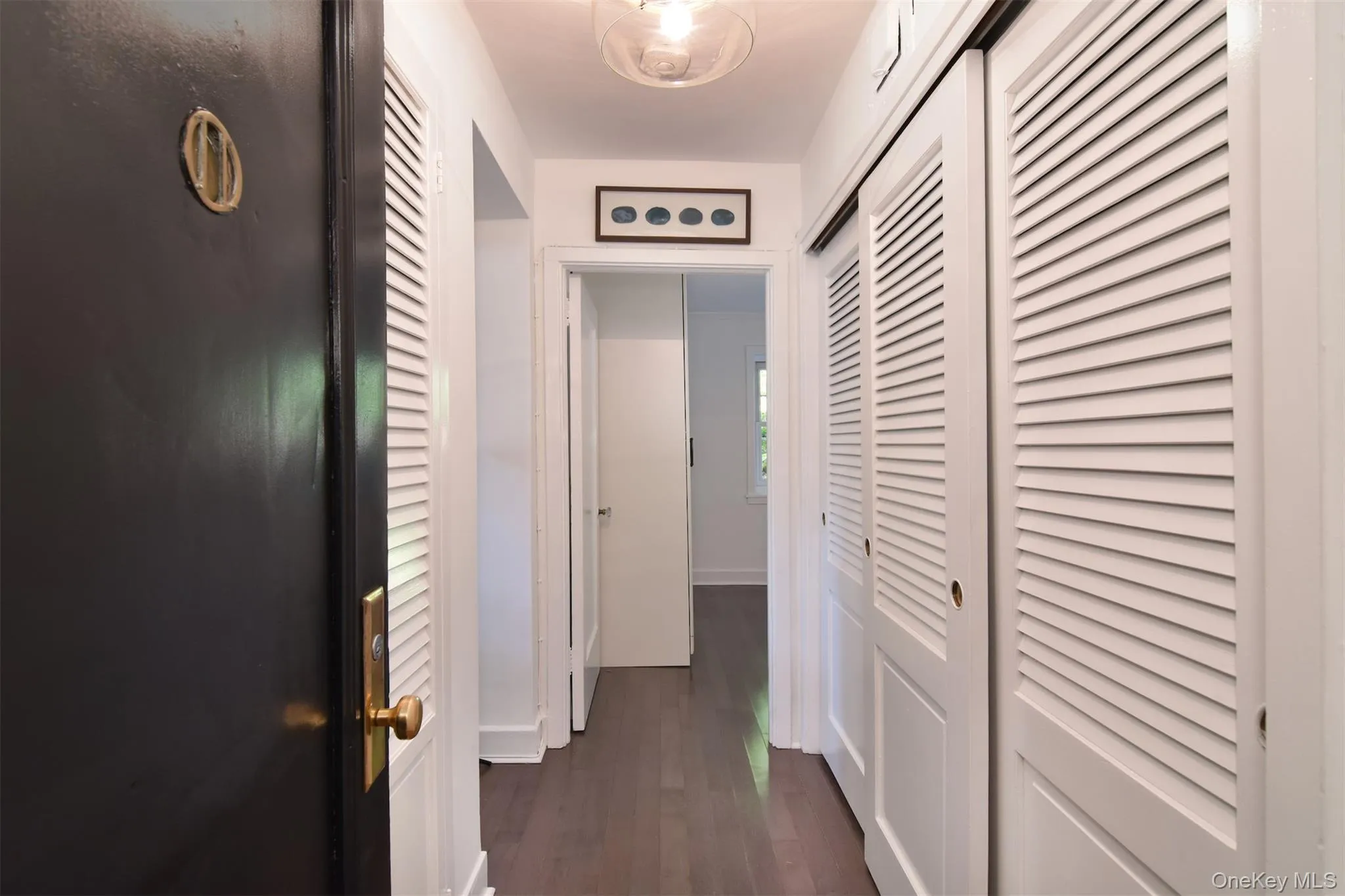 The hallway into #1A with custom closets & lighting. The hallway into #1A with custom closets & lighting.