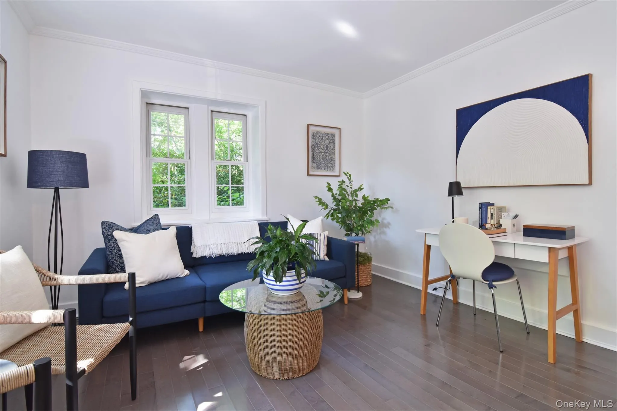 Living room with space for an office area. Living room with space for an office area.