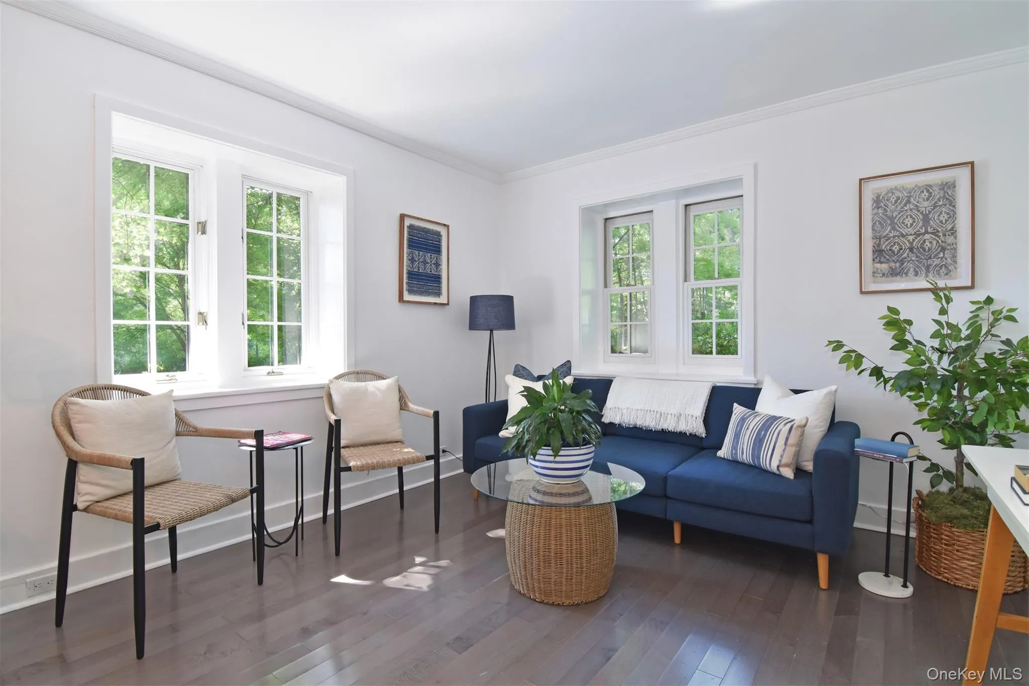 Spacious living room bathed in light from wonderful, deep-silled windows providing artistry & functionality. Spacious living room bathed in light from wonderful, deep-silled windows providing artistry & functionality.