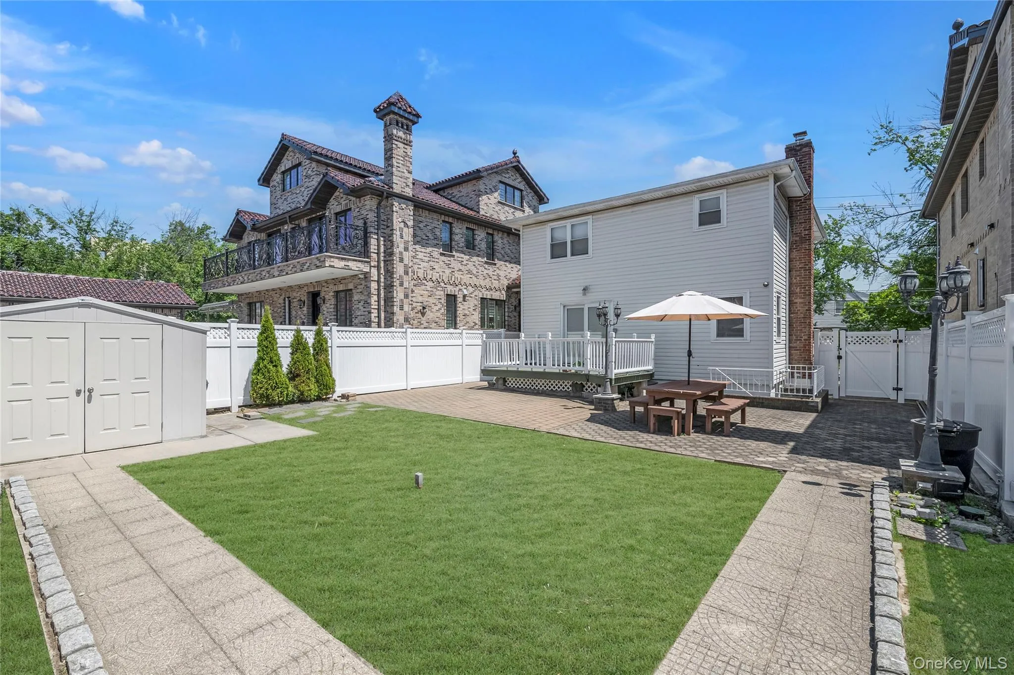 Spacious backyard with the pvs white fence all around house Spacious backyard with the pvs white fence all around house