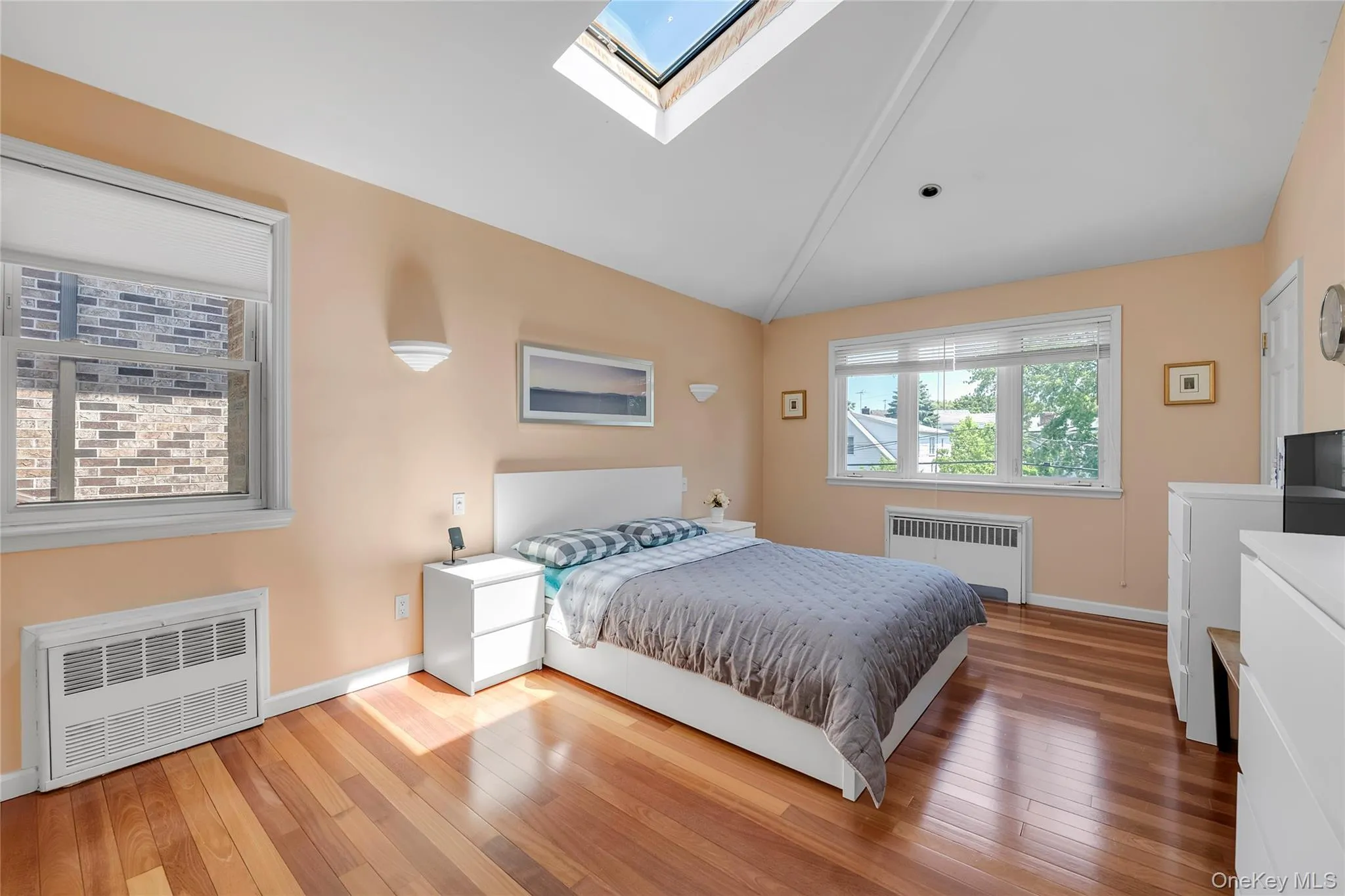 Primary bedroom #2 on the 2nd floor with a skylite with 2 windows & 3 spacious closets Primary bedroom #2 on the 2nd floor with a skylite with 2 windows & 3 spacious closets