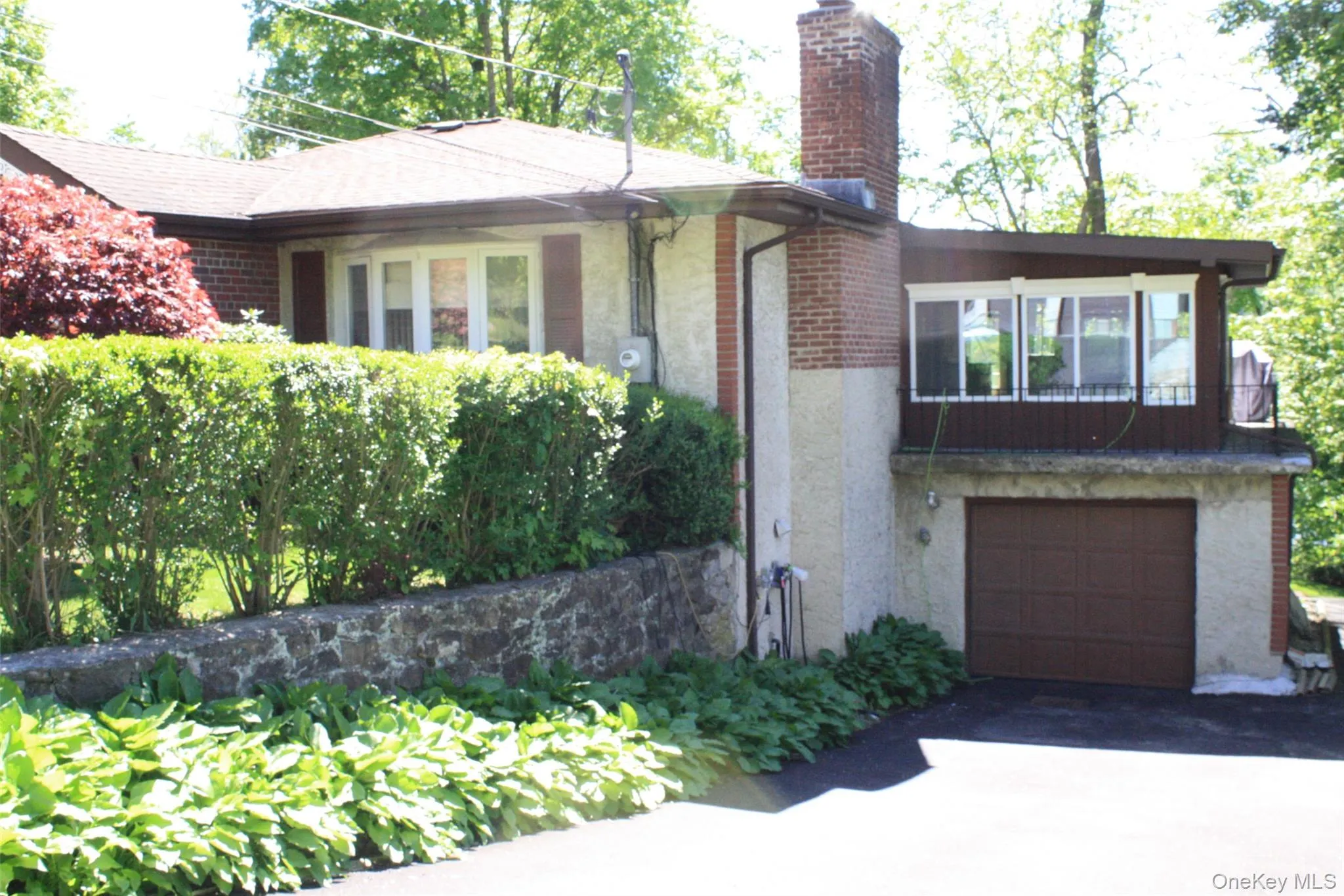 Front of home with garage Front of home with garage