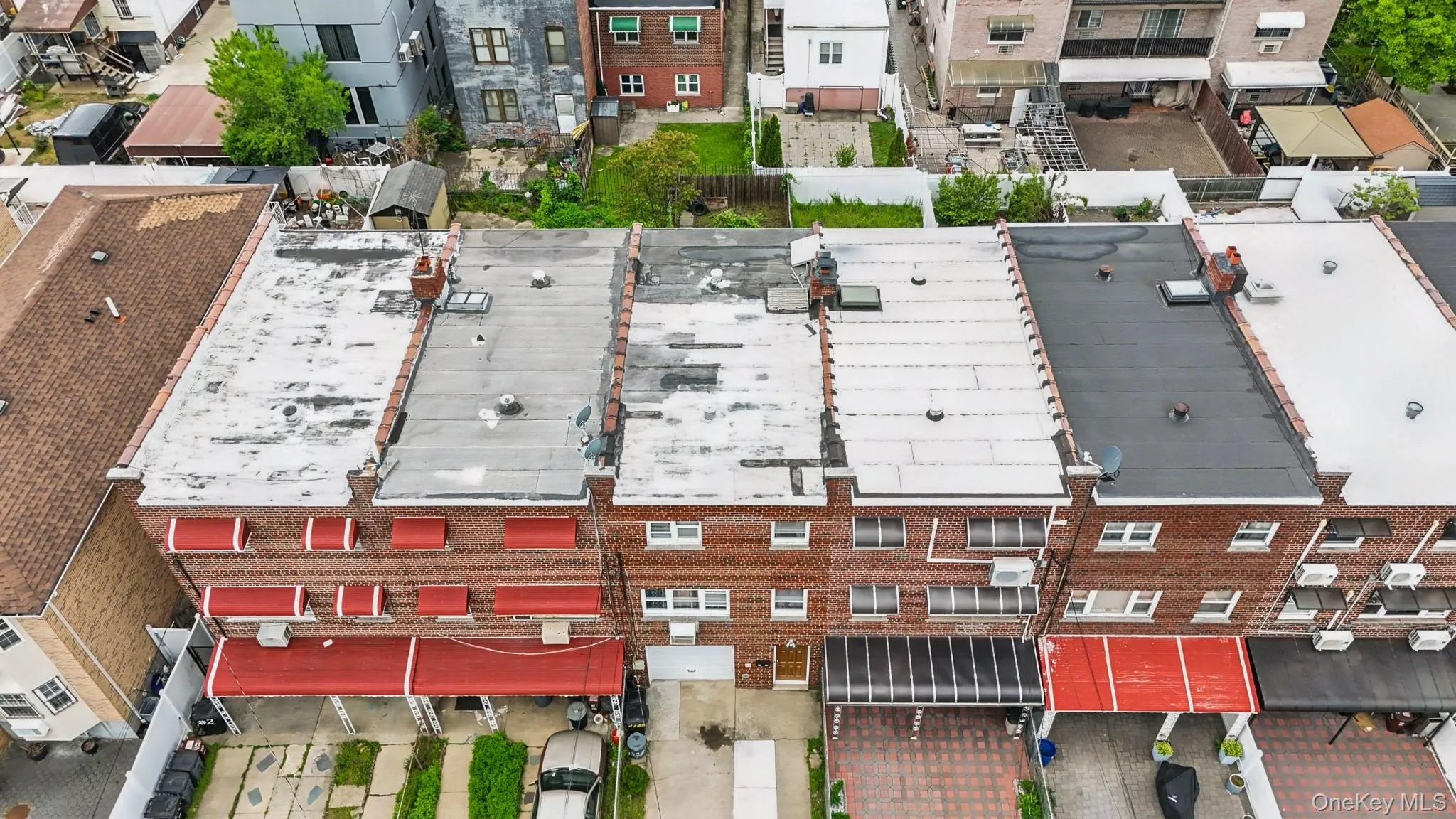 Aerial perspective showcasing multiple attached residential properties Aerial perspective showcasing multiple attached residential properties