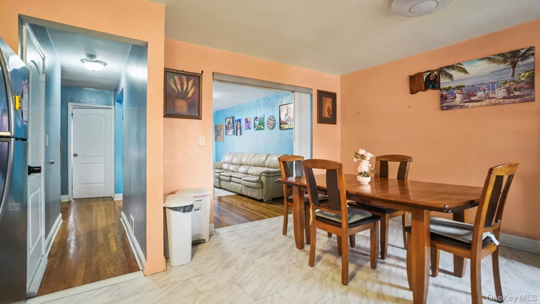 Dining area featuring tile flooring, a built-in ceiling light fixture, and a wide entryway Dining area featuring tile flooring, a built-in ceiling light fixture, and a wide entryway