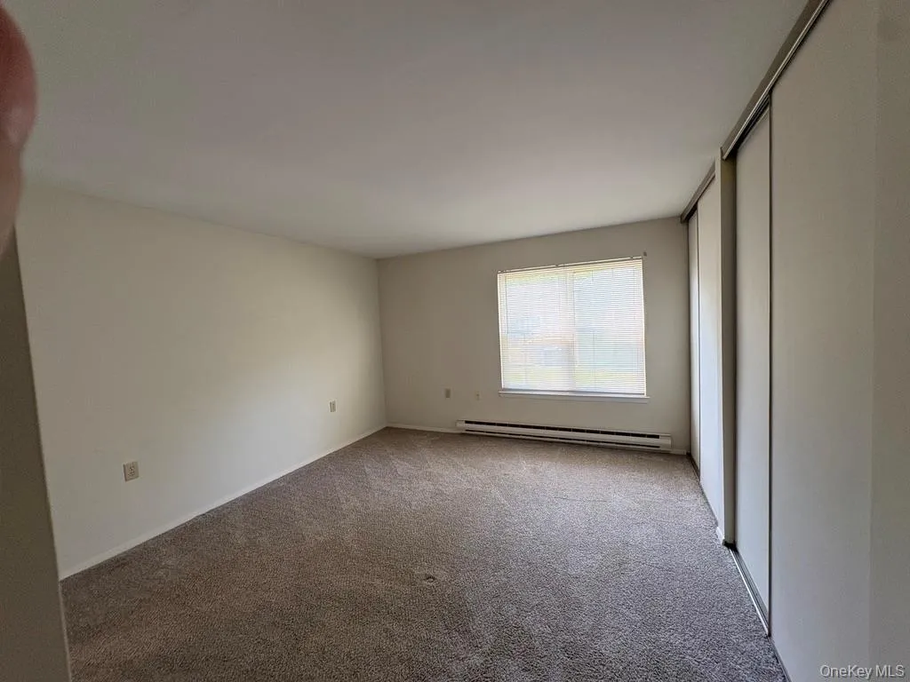Primary bedroom with double closets, has an updated ensuite featuring a walk in shower. Primary bedroom with double closets, has an updated ensuite featuring a walk in shower.