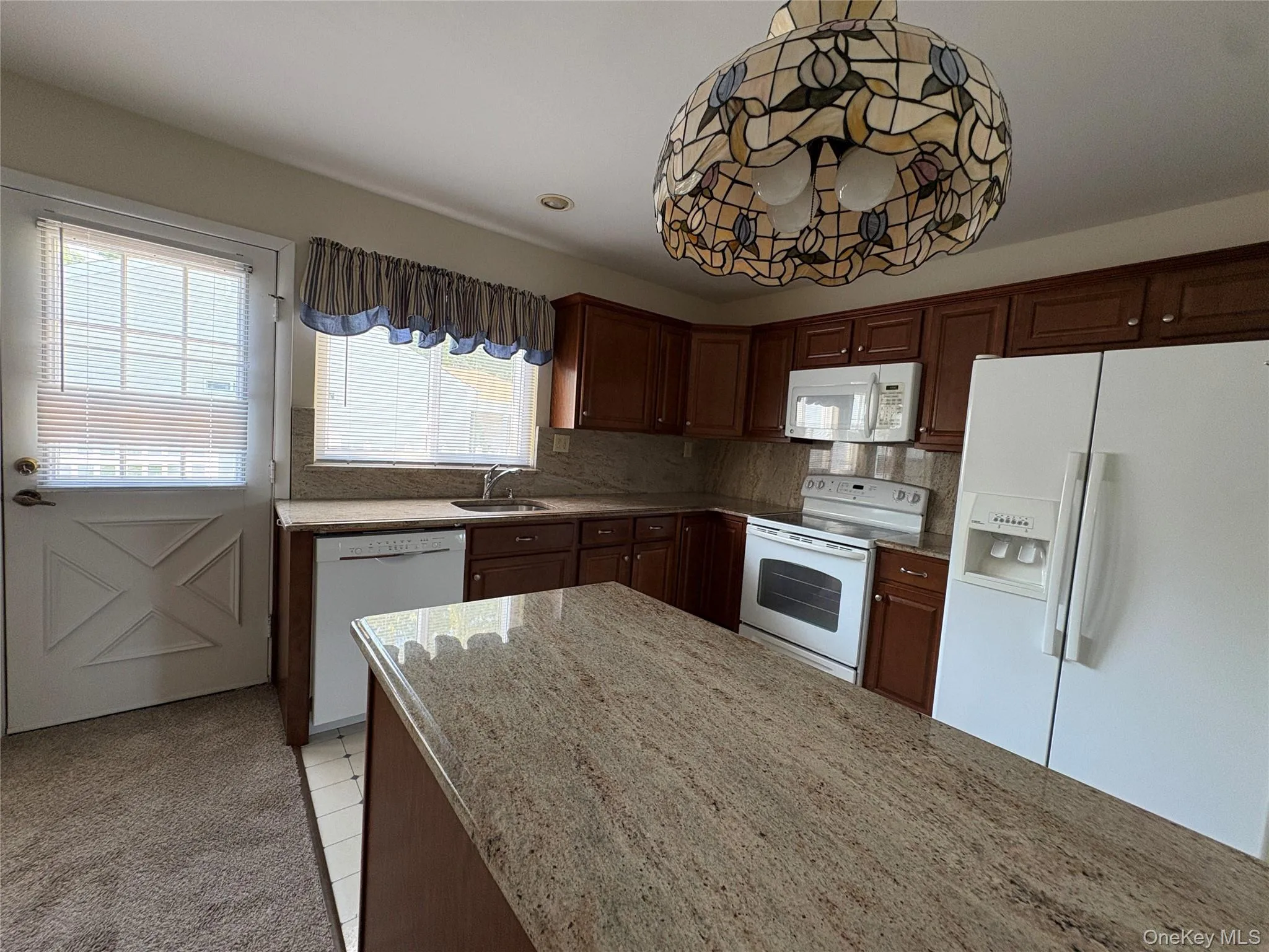 Off the den is the backyard fenced in patio, great for bbqs and entertaining or just relaxing. Off the den is the backyard fenced in patio, great for bbqs and entertaining or just relaxing.