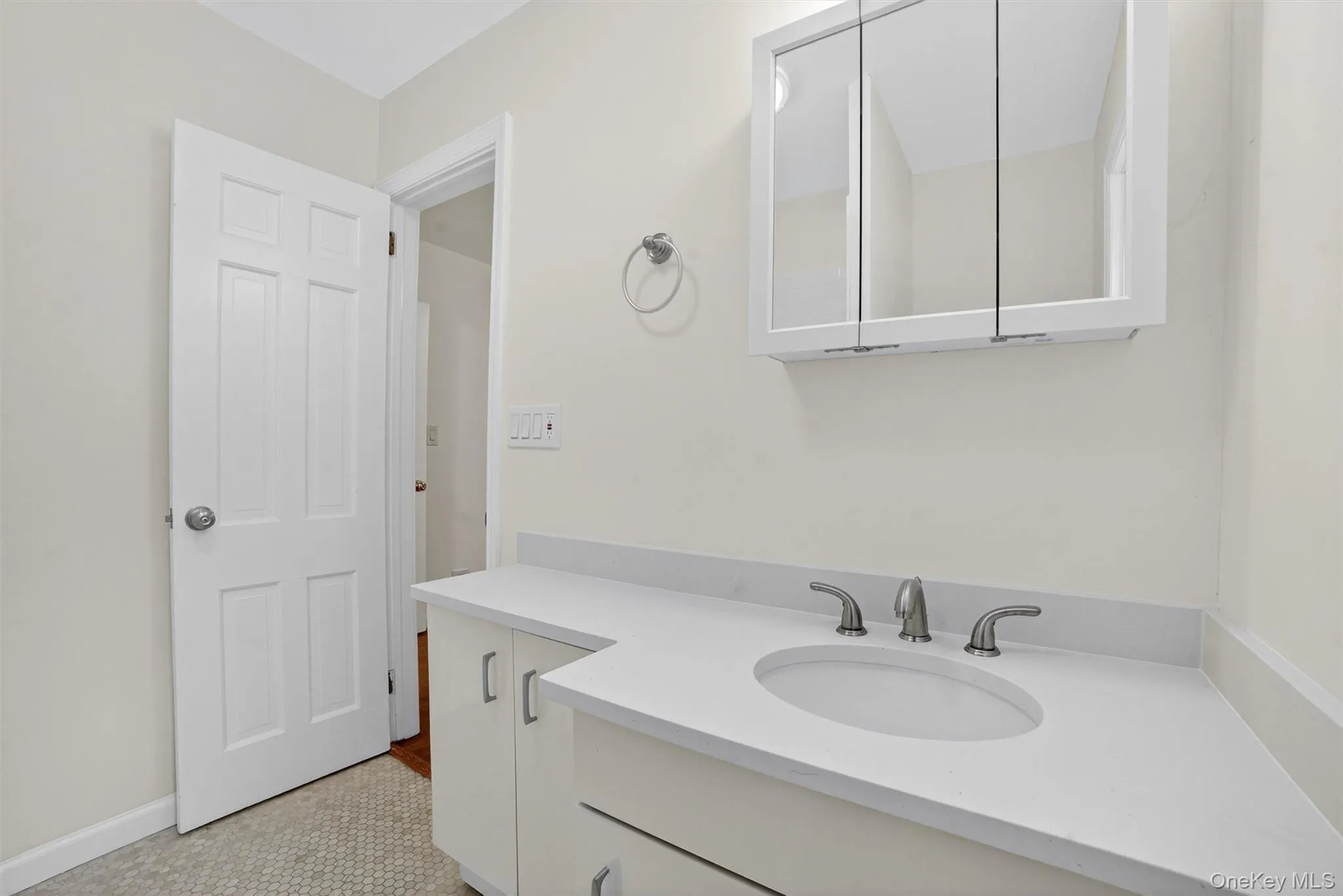 Bathroom with vanity and tile patterned flooring Bathroom with vanity and tile patterned flooring