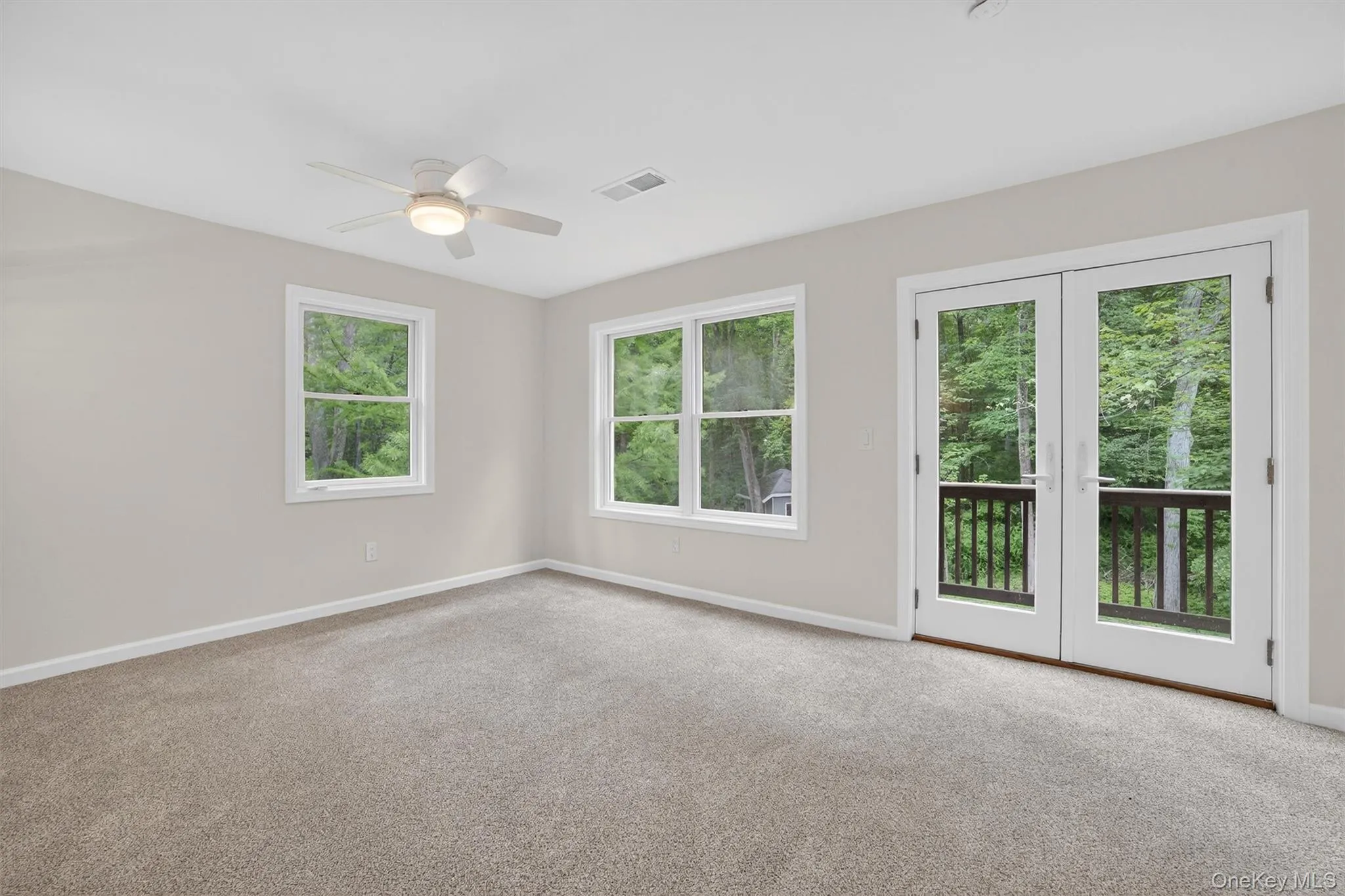 Spare room with ceiling fan and carpet Spare room with ceiling fan and carpet