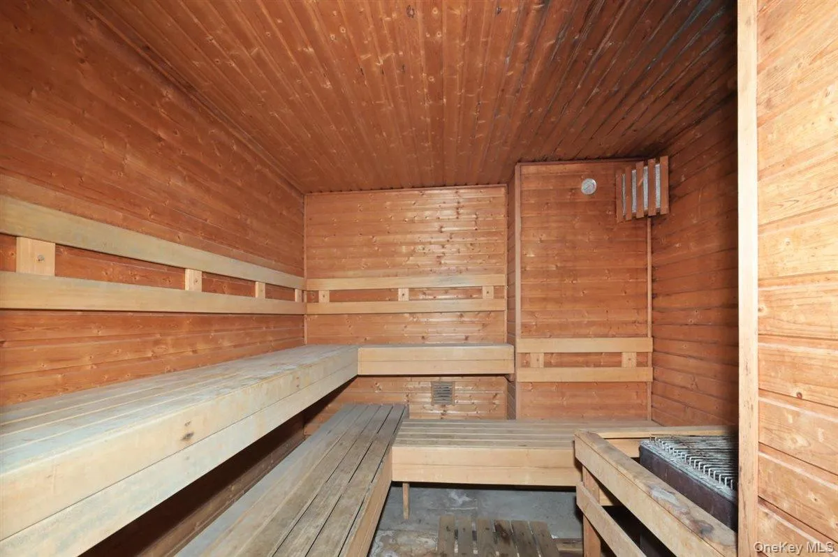 Sauna / steam room featuring wooden walls and wooden ceiling Sauna / steam room featuring wooden walls and wooden ceiling