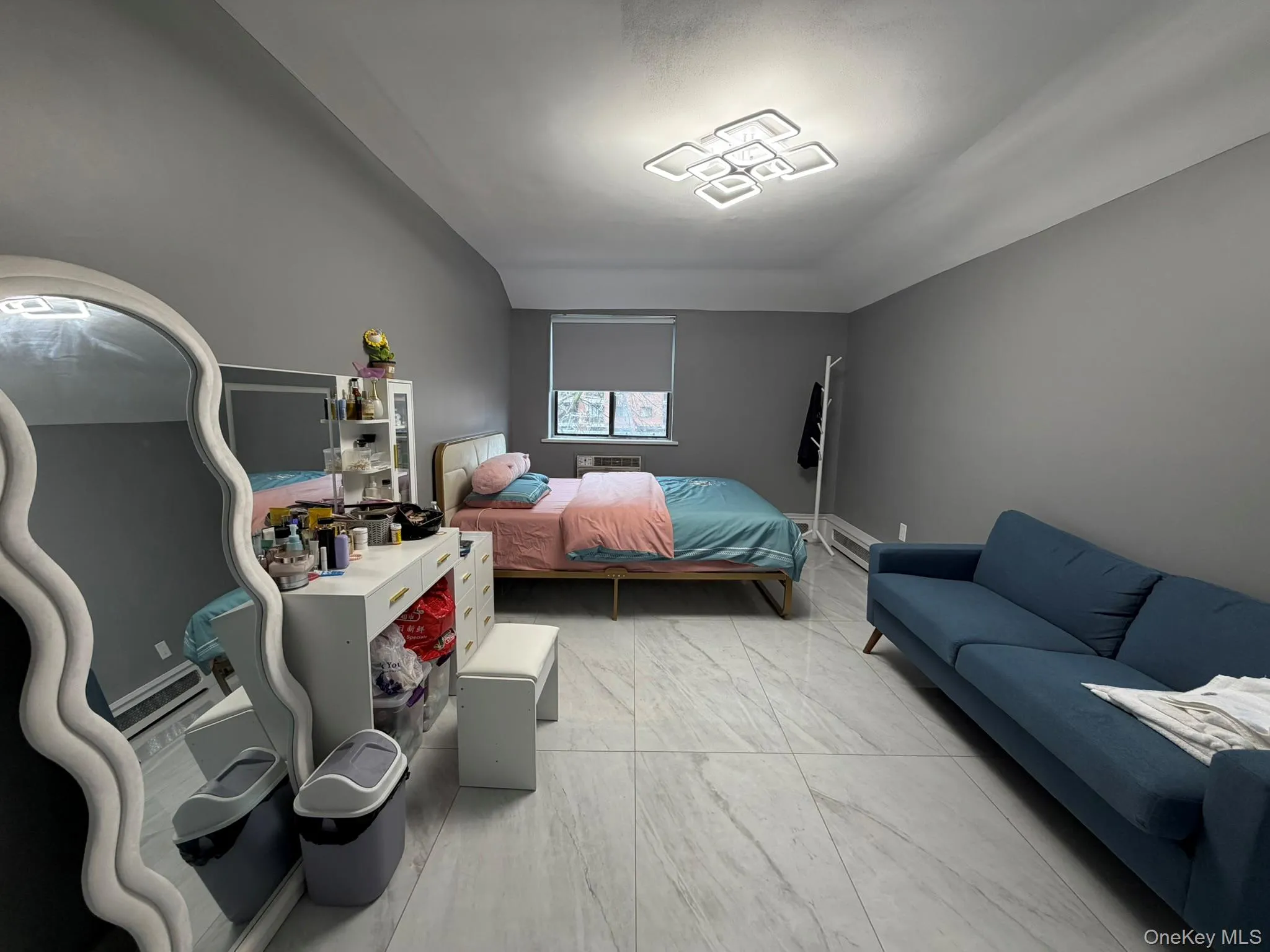 Bedroom featuring light marble finish flooring Bedroom featuring light marble finish flooring