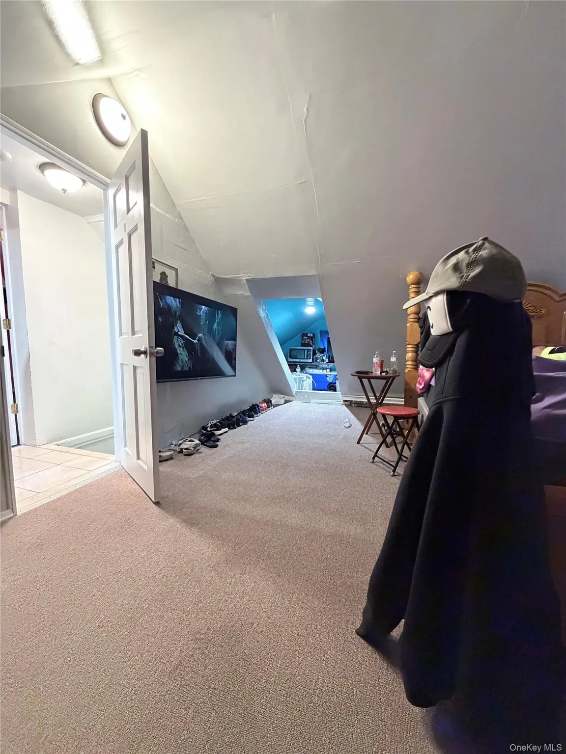 2nd. floor bedroom featuring sloped ceilings, a closet with a window, clear carpeting 2nd. floor bedroom featuring sloped ceilings, a closet with a window, clear carpeting