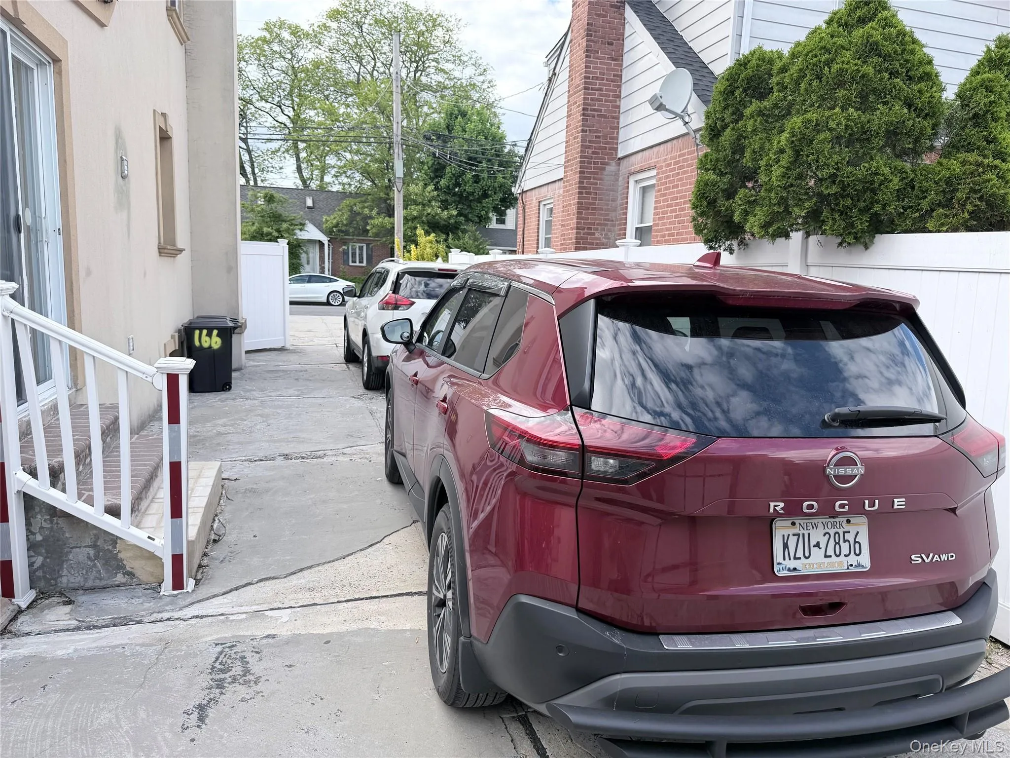 Driveway featuring at least 3 car spaces. Driveway featuring at least 3 car spaces.