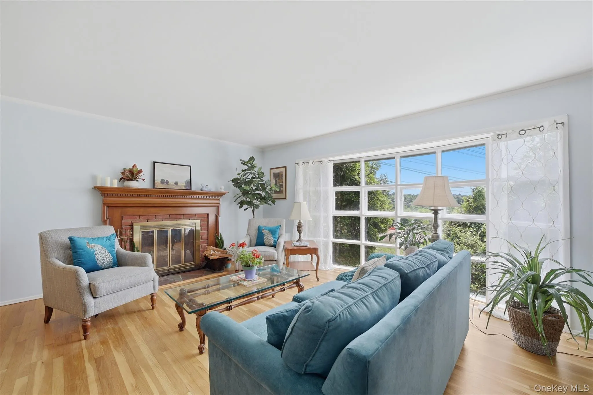 Bright & Light Living Room with Floor to Ceiling Windows and Fireplace Bright & Light Living Room with Floor to Ceiling Windows and Fireplace