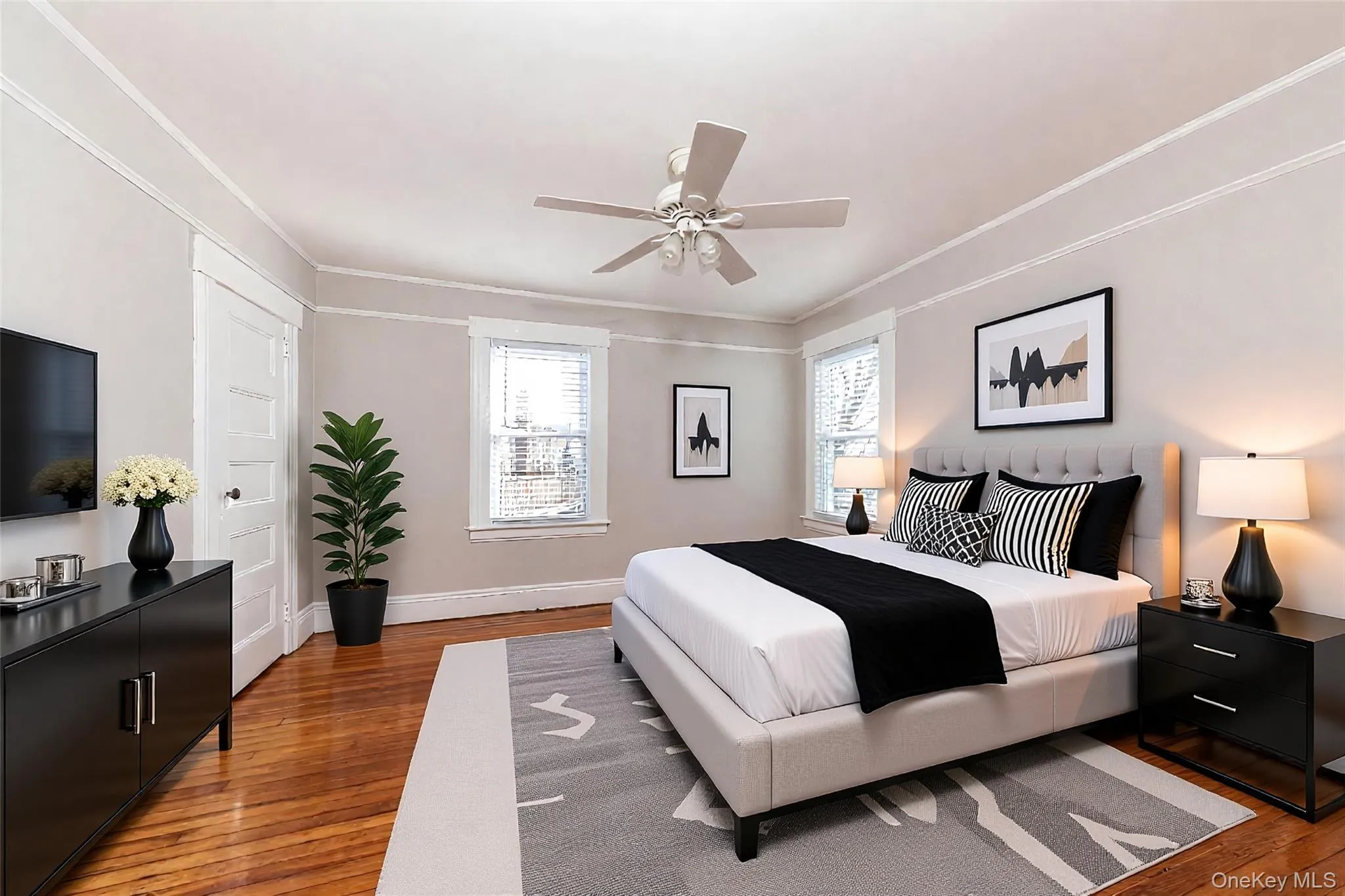 Bright and spacious primary bedroom filled with natural light (Staged) Bright and spacious primary bedroom filled with natural light (Staged)
