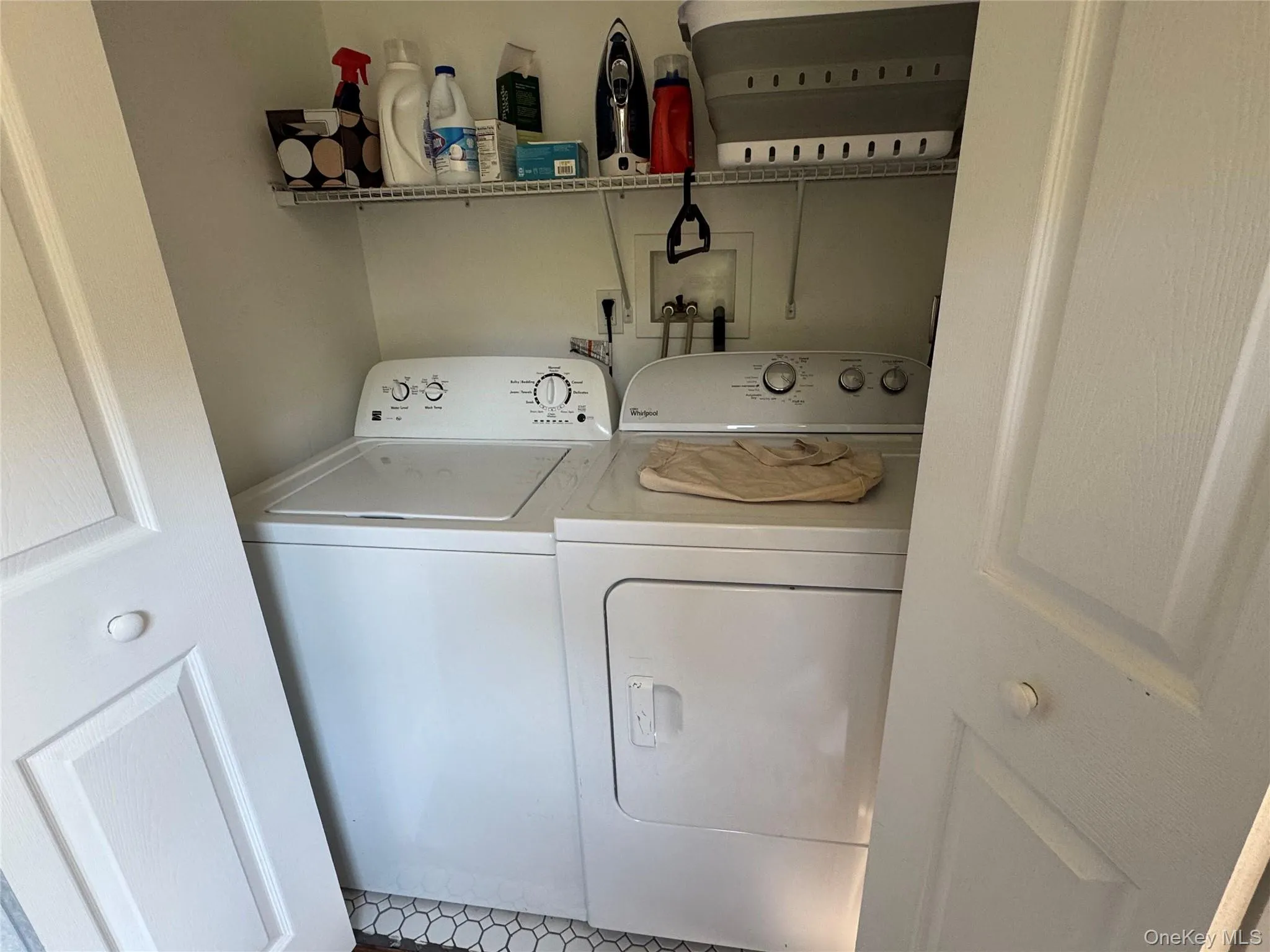Laundry closet with shelving Laundry closet with shelving
