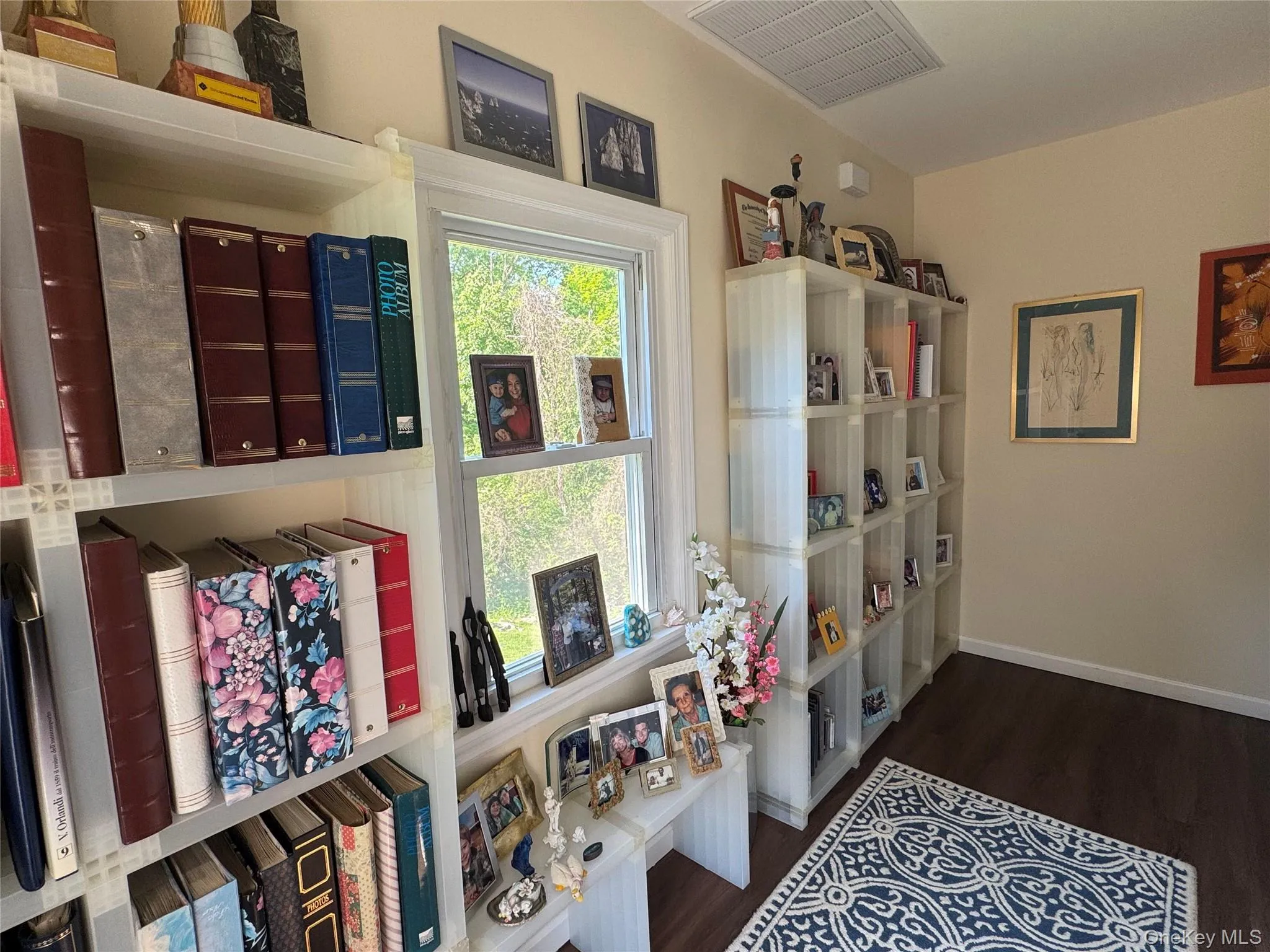 Upper floor landing with shelving, large window and Laundry closet Upper floor landing with shelving, large window and Laundry closet