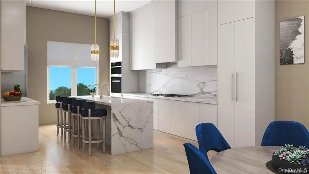 Kitchen featuring light hardwood / wood-style flooring, white cabinets, pendant lighting, light stone counters, and a kitchen island with sink Kitchen featuring light hardwood / wood-style flooring, white cabinets, pendant lighting, light stone counters, and a kitchen island with sink