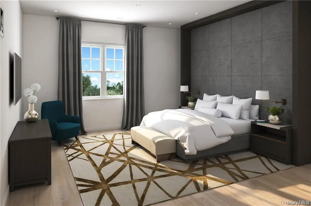 Bedroom featuring tile walls and light wood-type flooring Bedroom featuring tile walls and light wood-type flooring