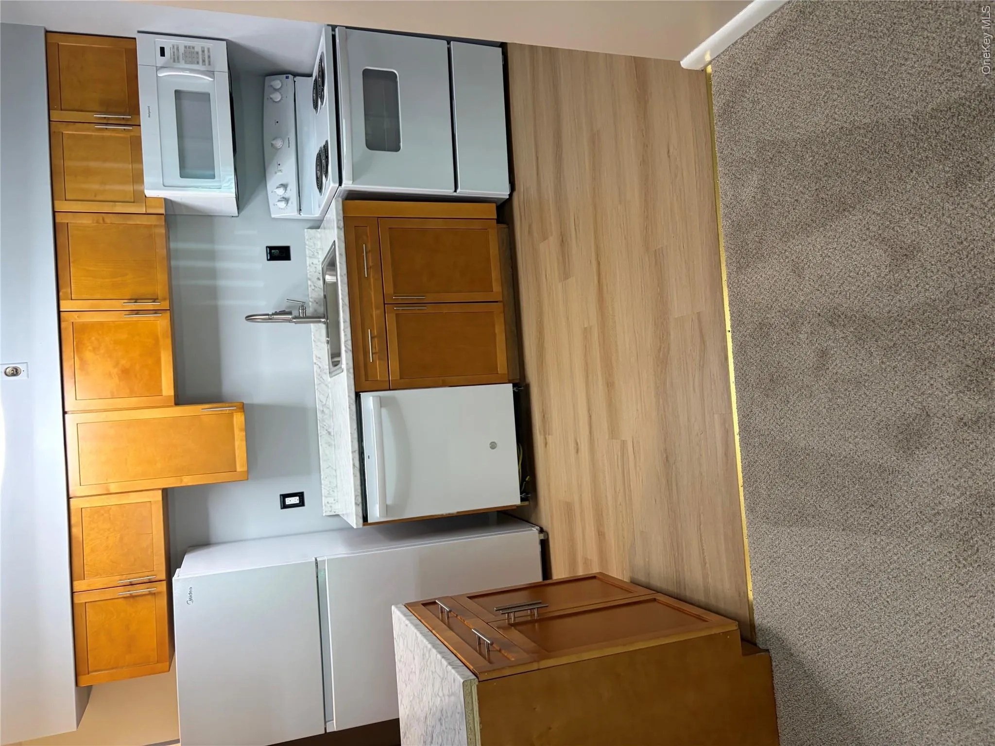 Updated kitchen, newer cabinets and counter tops with new appliances Updated kitchen, newer cabinets and counter tops with new appliances