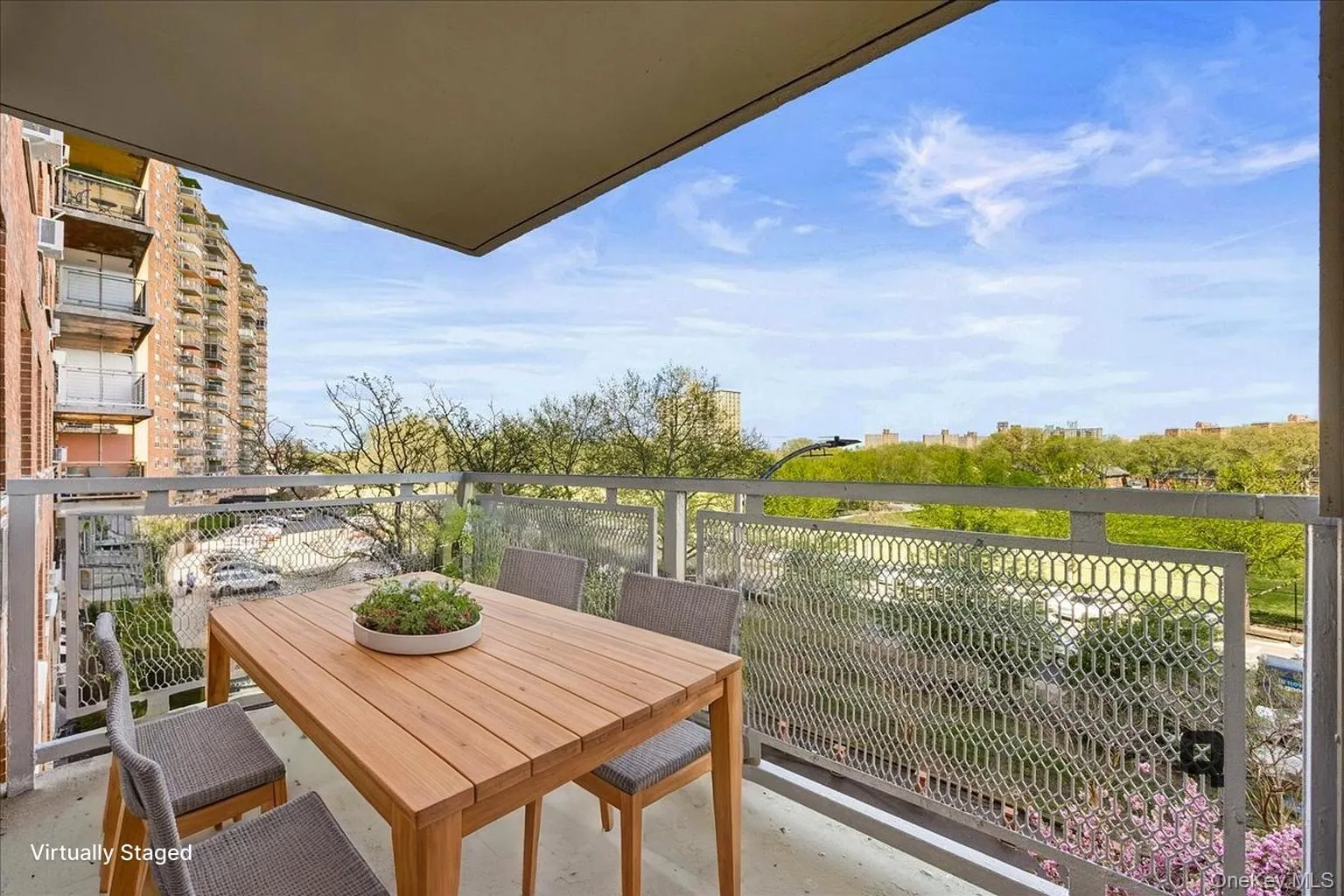 Balcony featuring a geometric metal railing and overhead coverage Balcony featuring a geometric metal railing and overhead coverage