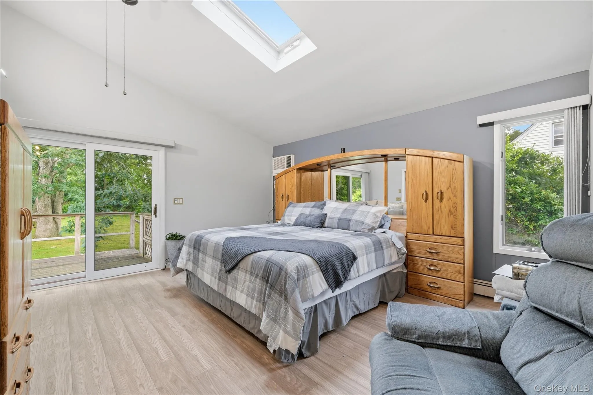 Primary Bedroom with SkyLight, Full Bathroom and Sliding Door to Deck Primary Bedroom with SkyLight, Full Bathroom and Sliding Door to Deck