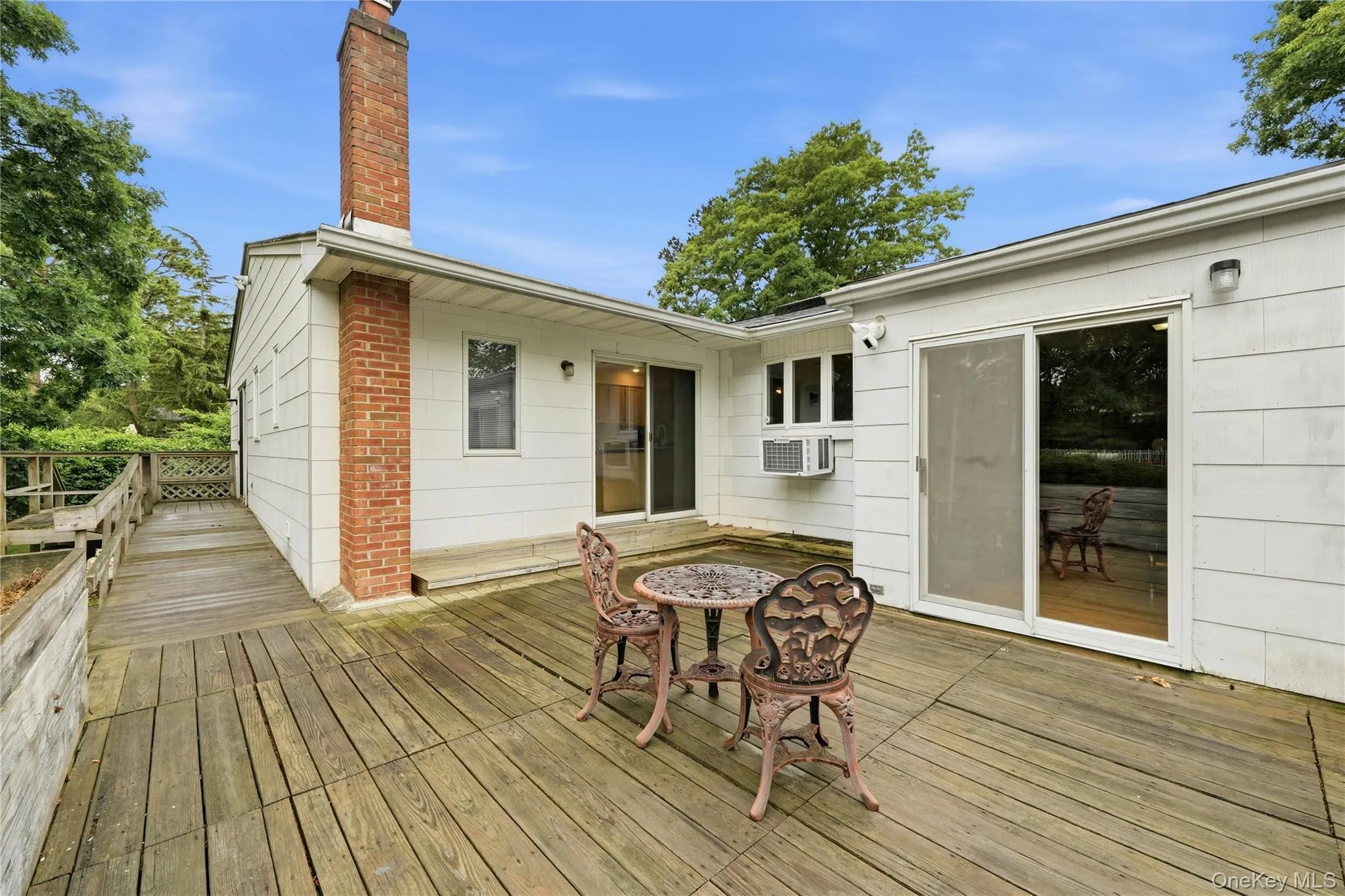 Deck from Kitchen and Den, and Ramp from Primary Bedroom Deck from Kitchen and Den, and Ramp from Primary Bedroom