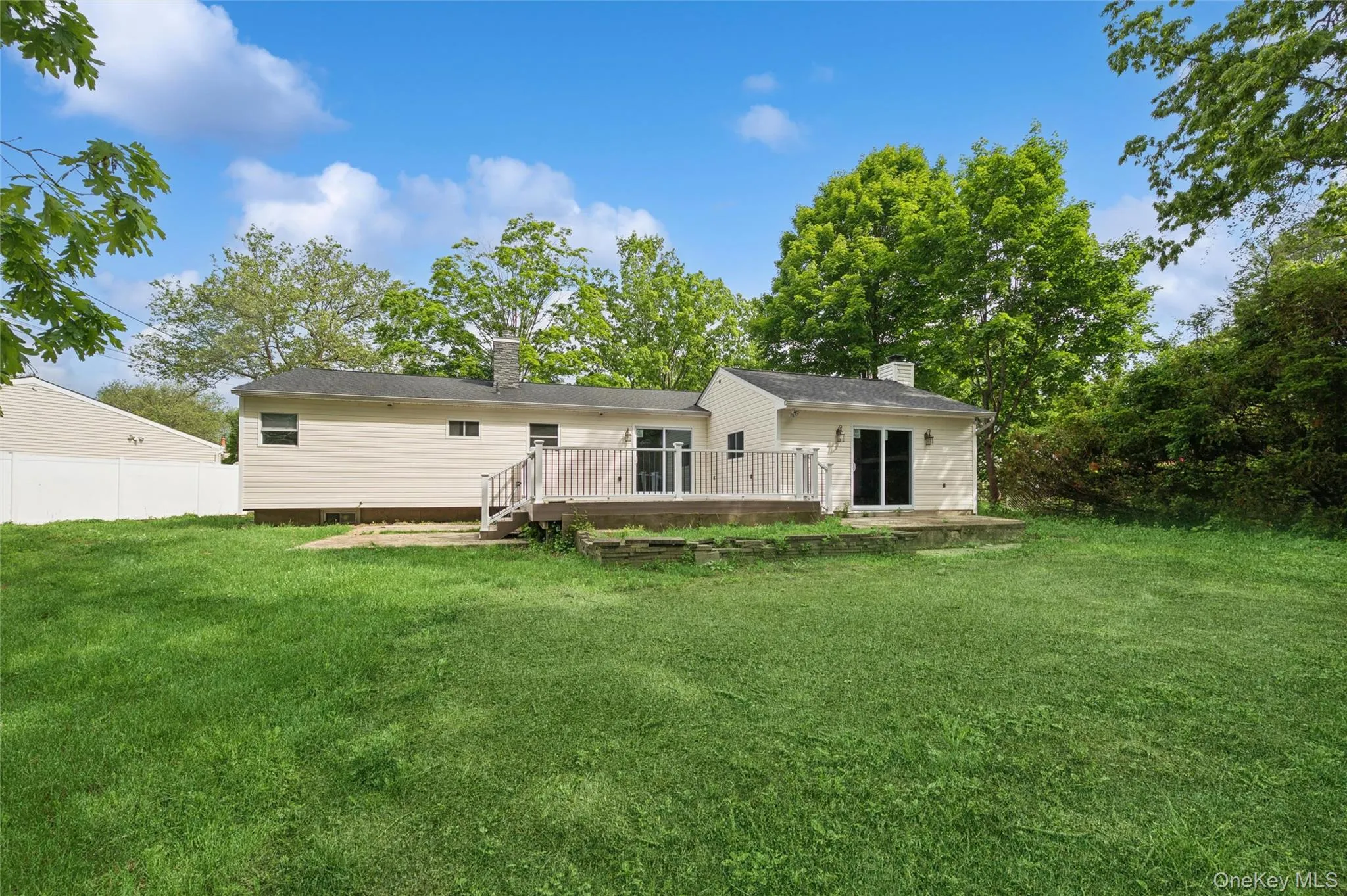 Rear of Home with Vast Lawn Area & Deck Rear of Home with Vast Lawn Area & Deck