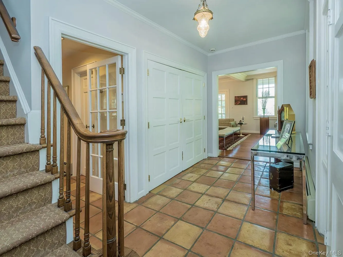 Long Entry Foyer with Terracotta Floor Tiles and entry to Kitchen and Living Room Long Entry Foyer with Terracotta Floor Tiles and entry to Kitchen and Living Room