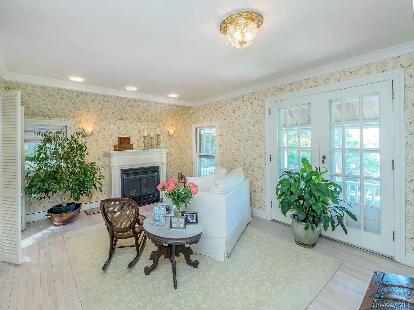 Sitting Area with Fireplace and French Doors that open up to the Balcony Sitting Area with Fireplace and French Doors that open up to the Balcony