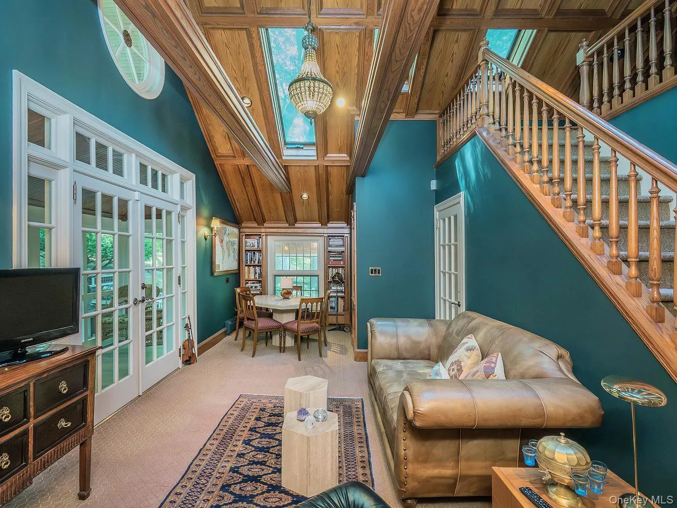 English Inspired Library with French Doors Leading to Screened-In Porch English Inspired Library with French Doors Leading to Screened-In Porch