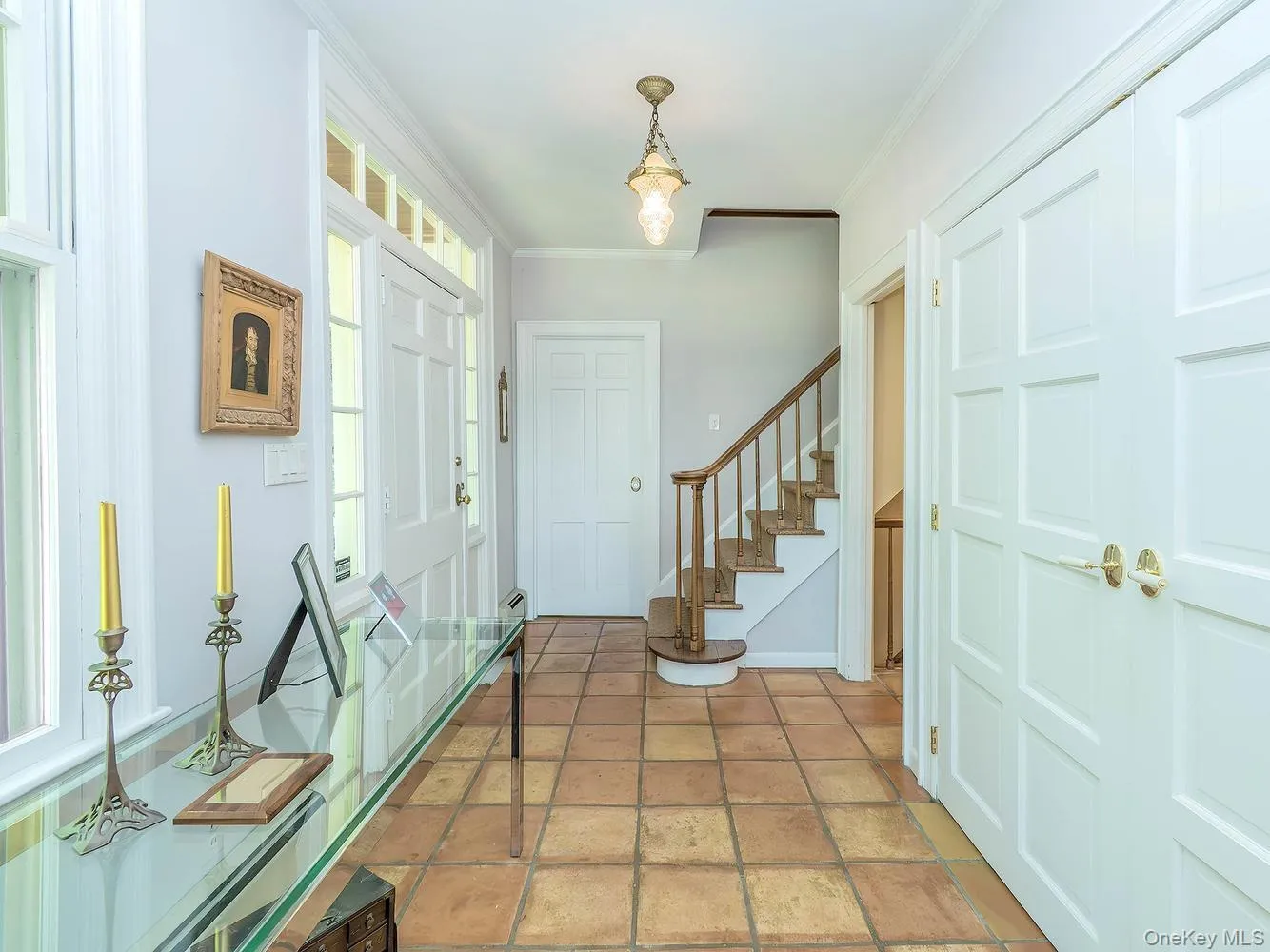 Entry Foyer with Large closet, stairs to Second Floor and first bedroom/office Entry Foyer with Large closet, stairs to Second Floor and first bedroom/office
