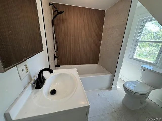 Bathroom #1 with view of the sink, toilet ceramic tile flooring and the window... Bathroom #1 with view of the sink, toilet ceramic tile flooring and the window...