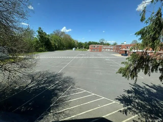 View of the paved parking area of the school next door... View of the paved parking area of the school next door...