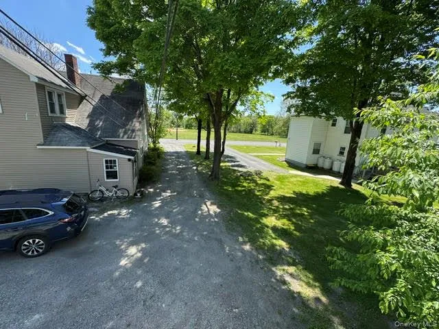 View of the driveway and the other unit next door. View of the driveway and the other unit next door.