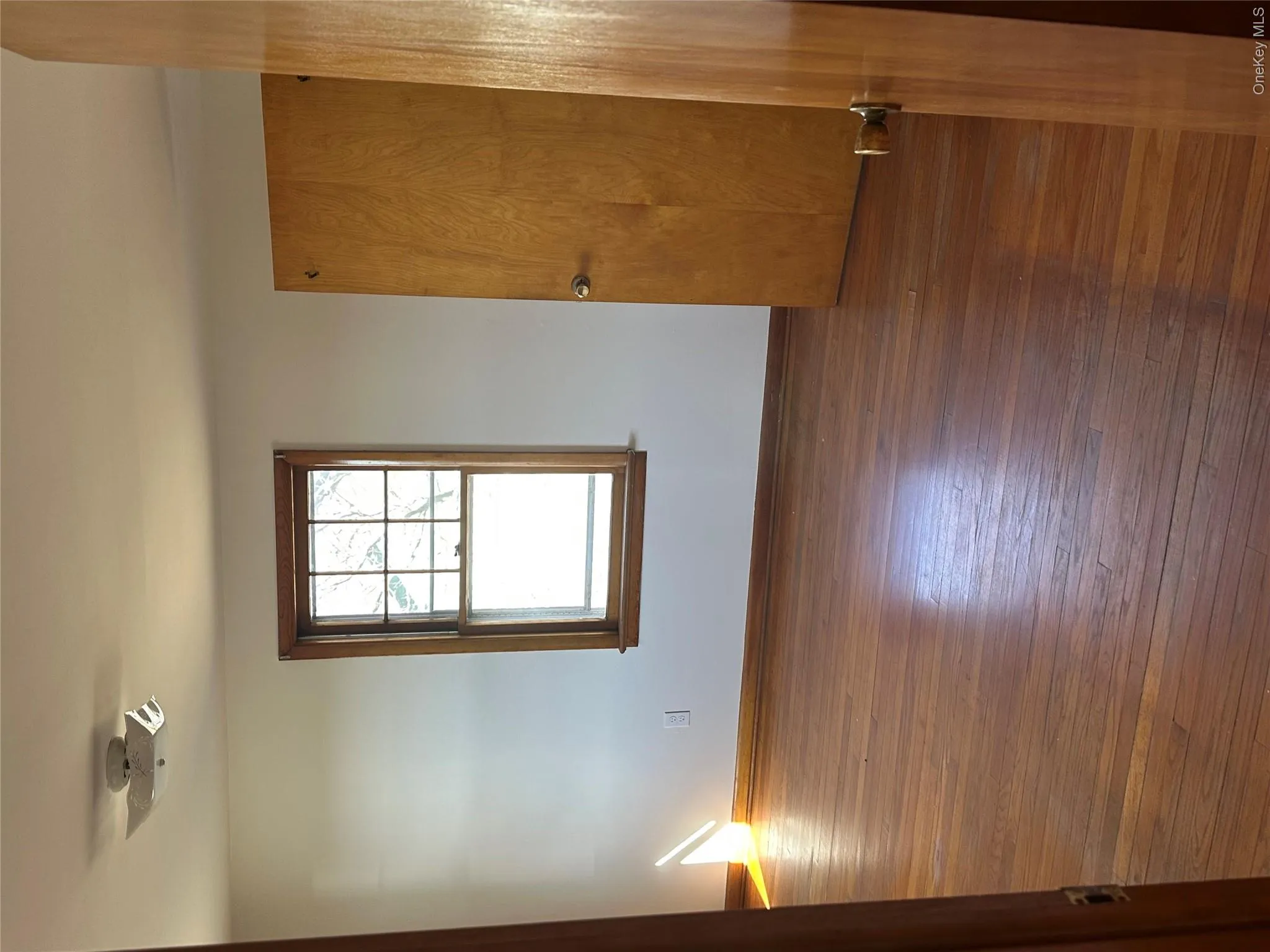 One of three bright rooms with hardwood floors One of three bright rooms with hardwood floors