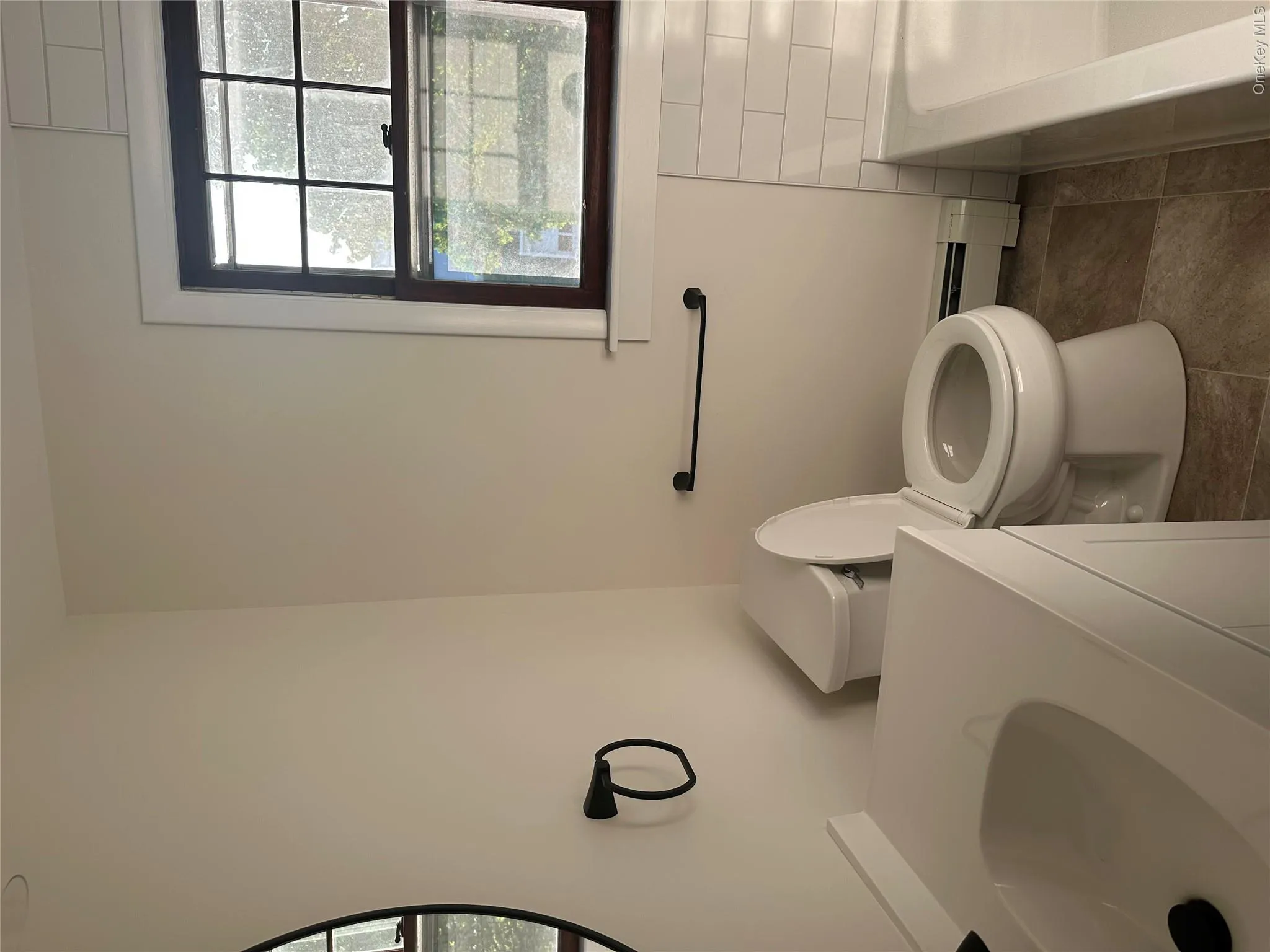 The second bathroom is located on the upper level with the bedrooms and office The second bathroom is located on the upper level with the bedrooms and office